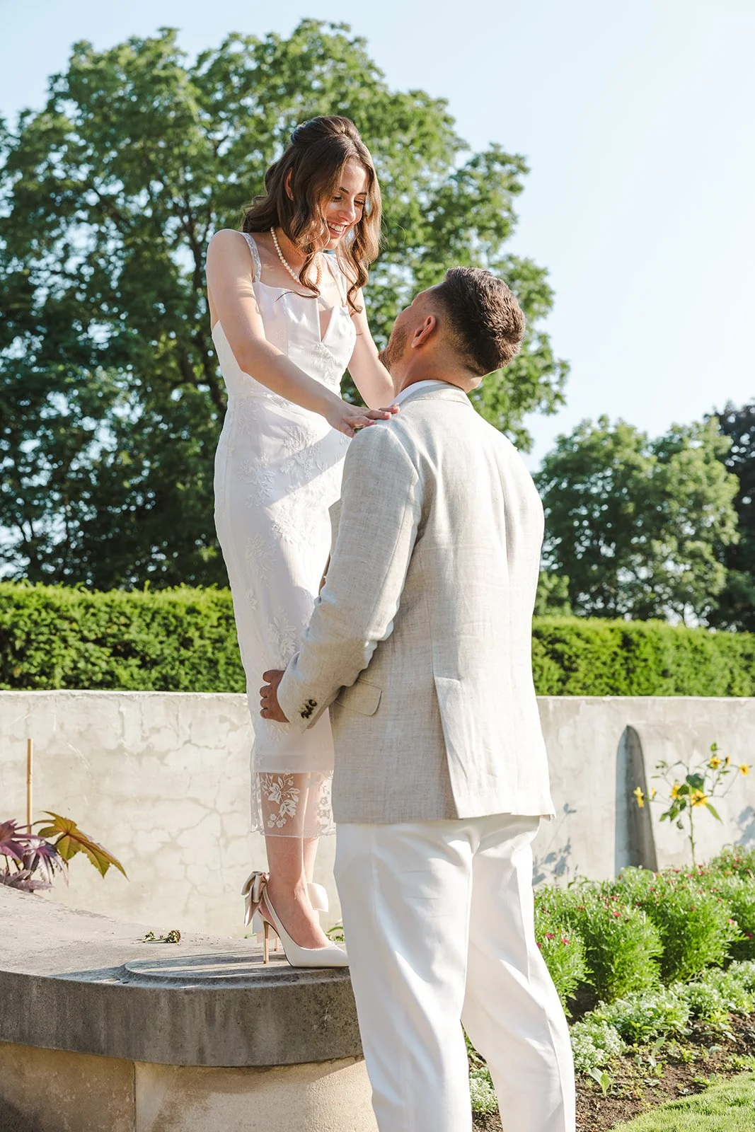 Woman standing on ledge with man  Ontario Engagement  Fedora Media.jpg