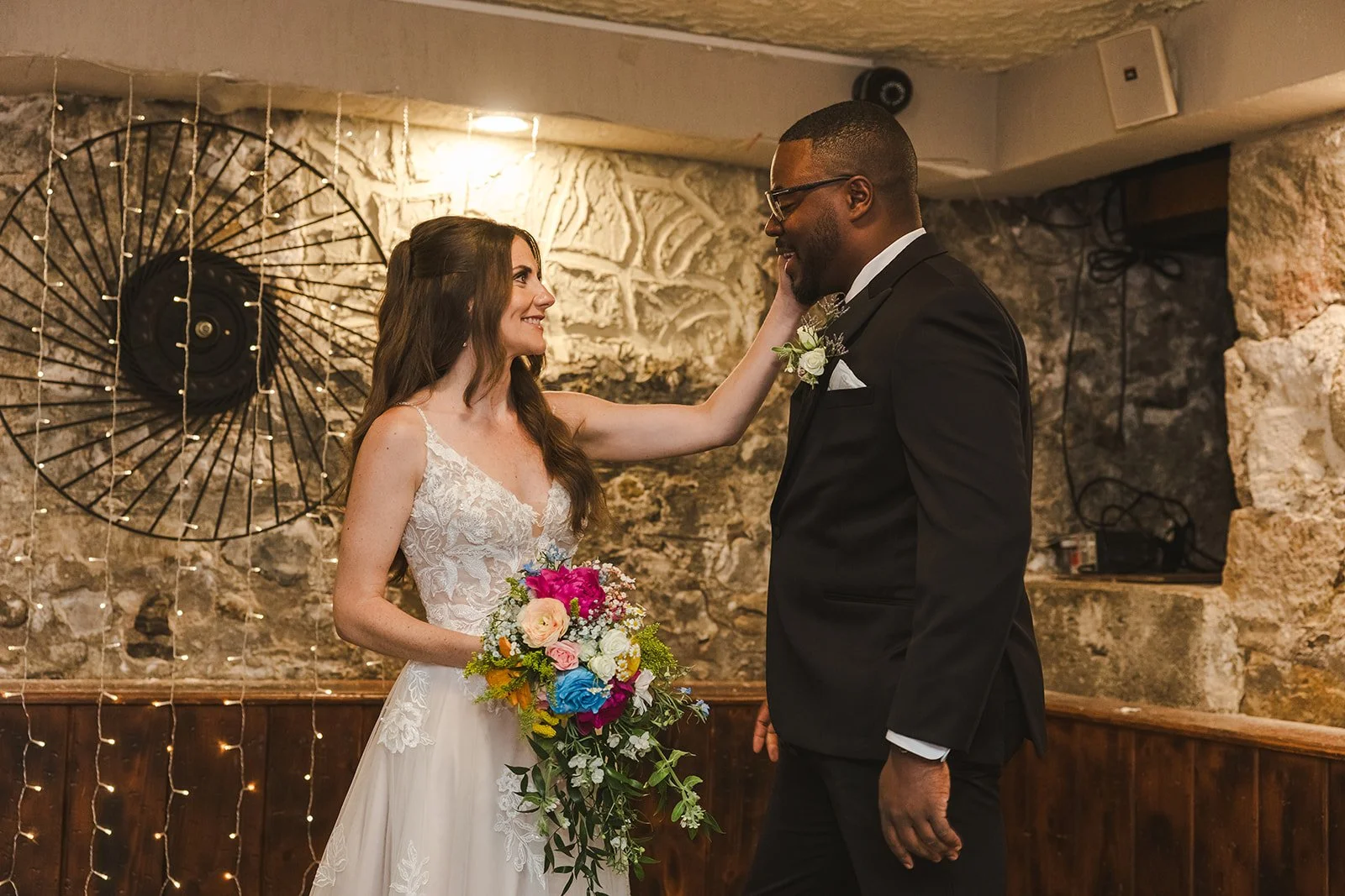 Bride hand on grooms face  River's Edge  Arlington Hotel  Paris, ON  Fedora Media.jpg
