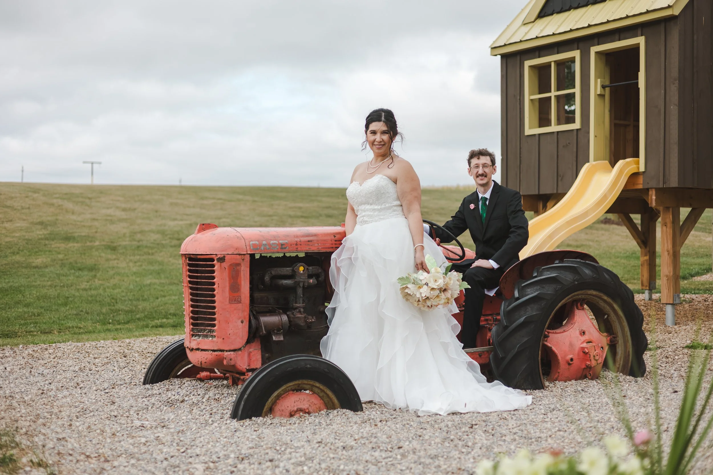 bride-and-groom-on-a-tractor-fedora-media.jpg