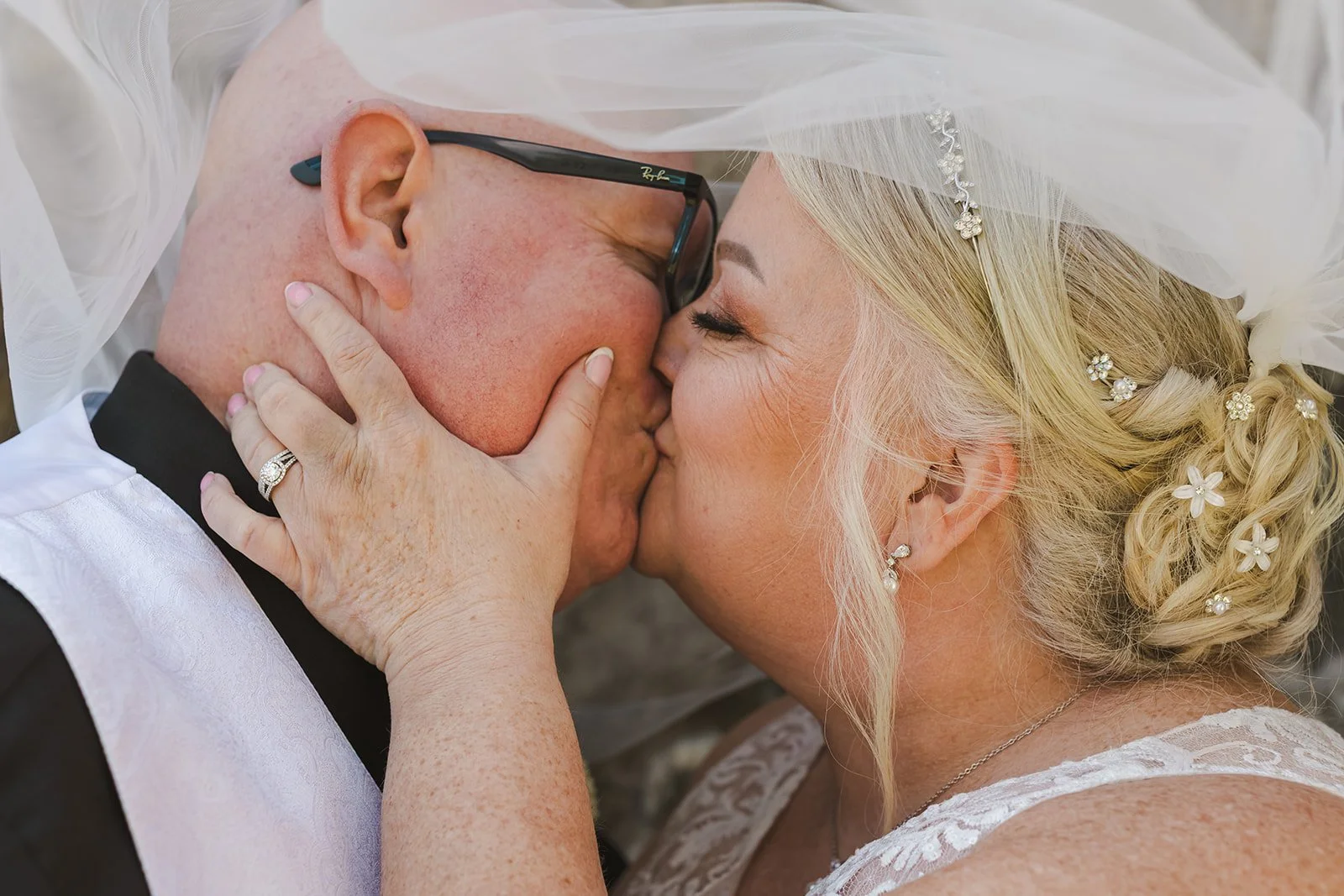 Bride and Groom kiss under veil  Cambridge Hotel  Cambridge, ON  Fedora Media.jpg