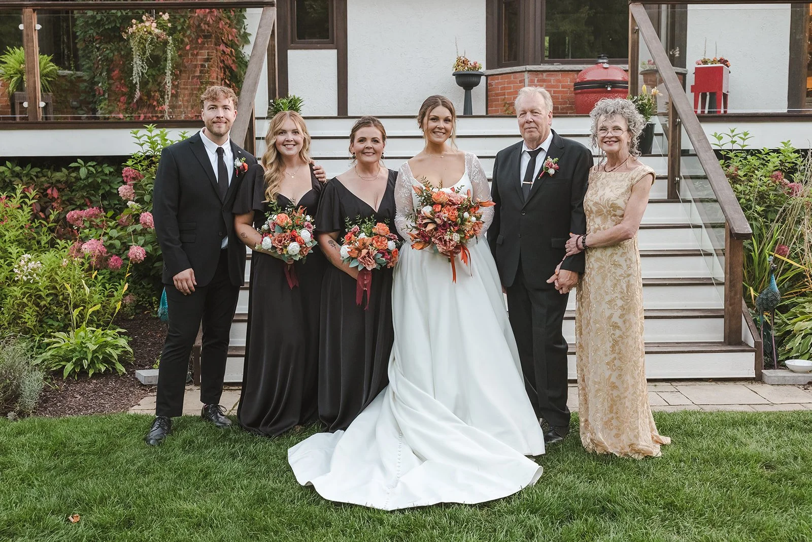 Bride and family posing in backyard  Erin Estates  Fedora Media.jpg
