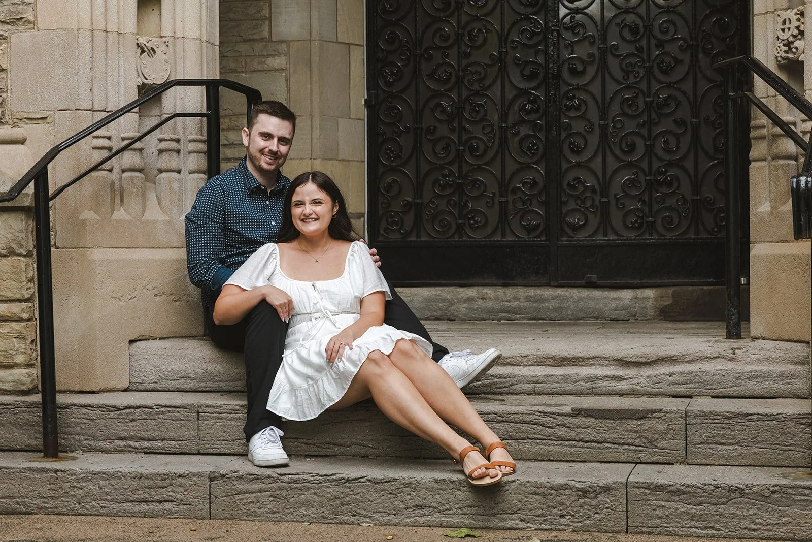 Enagaged couple sitting on stairs  Fedora Media.jpg