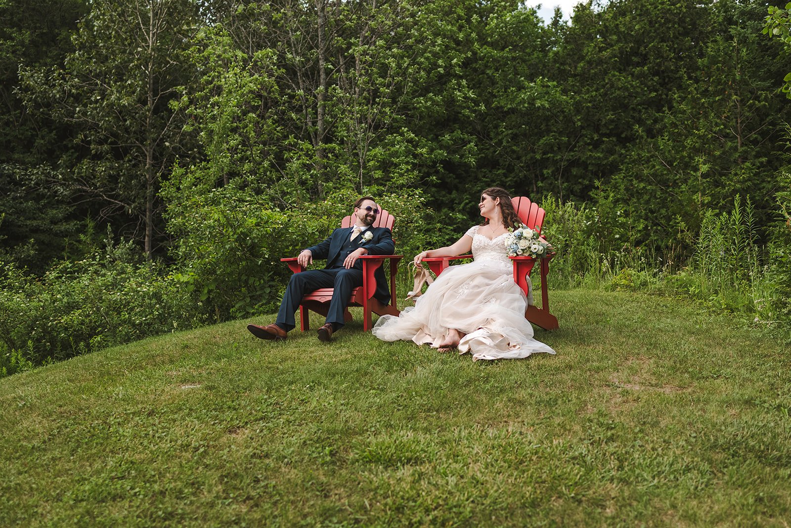 Bride and groom sitting in muskoka chairs  CJ Country events  Guelph, ON  Fedora Media.jpg