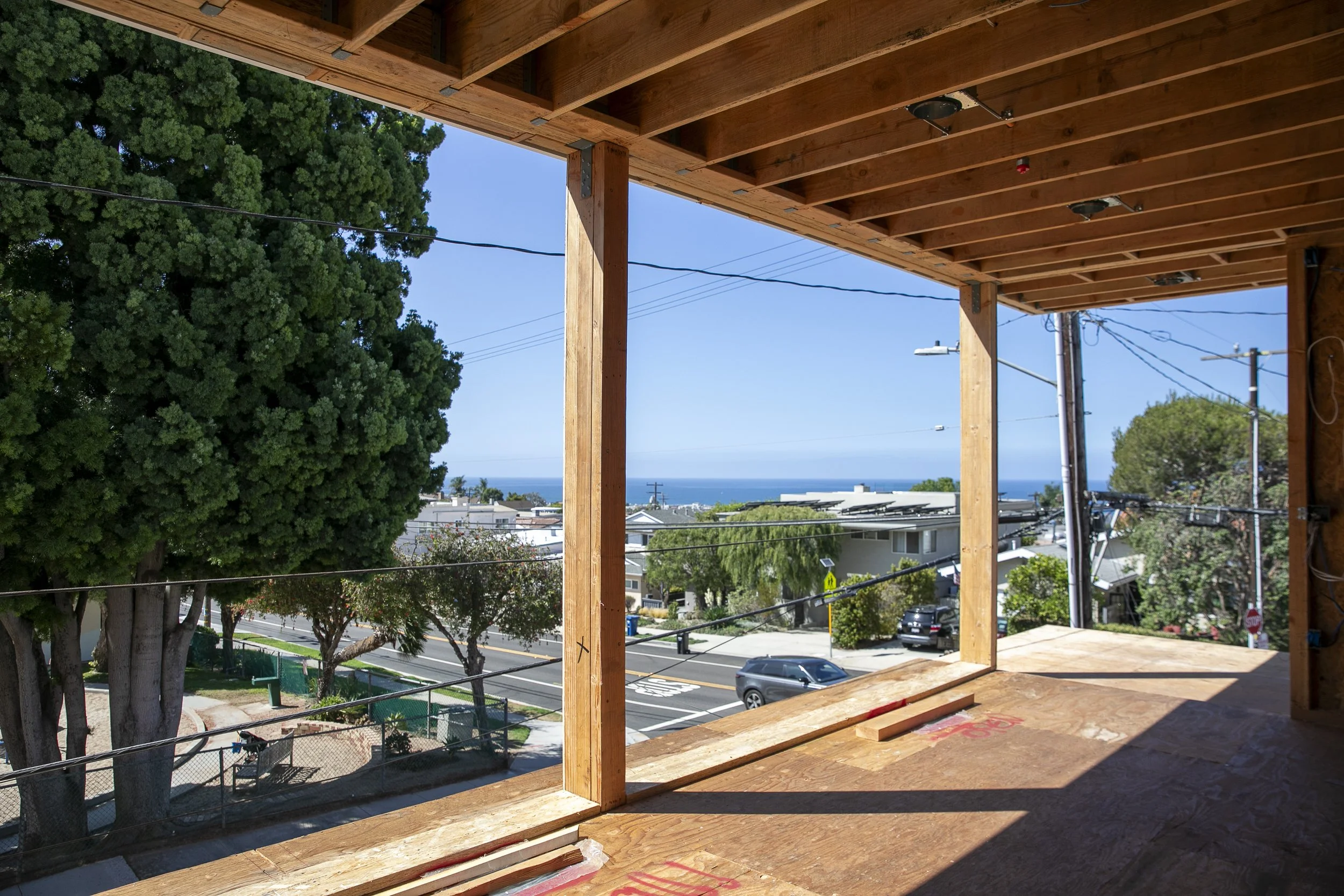 Framed second story under construction with ocean view