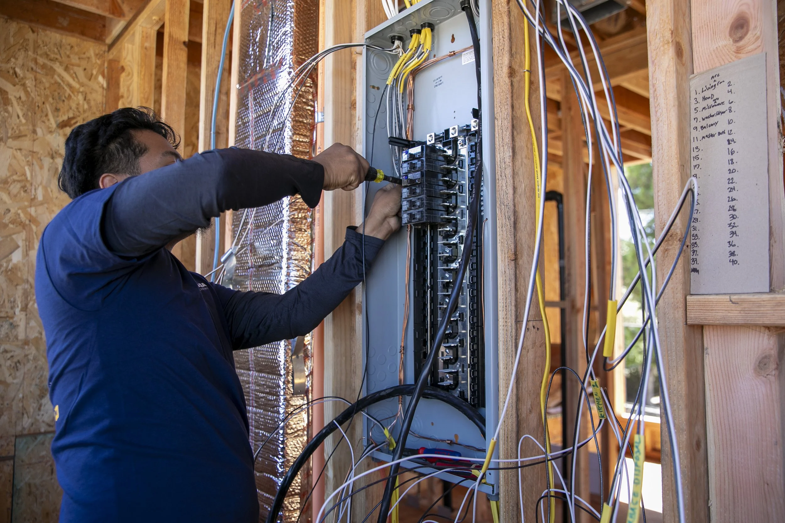 Quesada Electric electrician wiring breakers in electrical panel