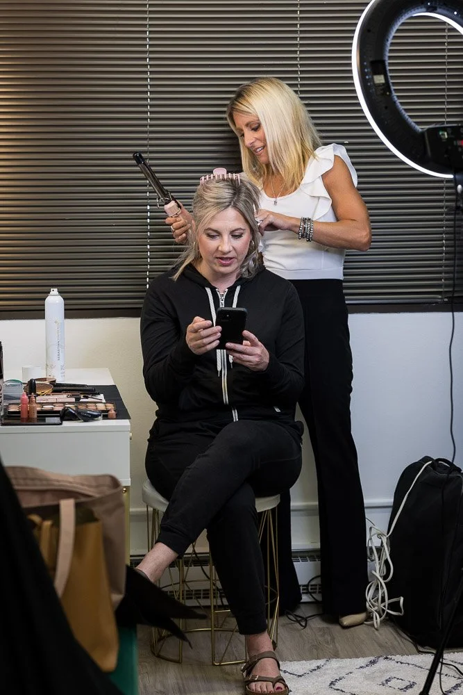 behind the scenes headshot client getting hair and makeup done