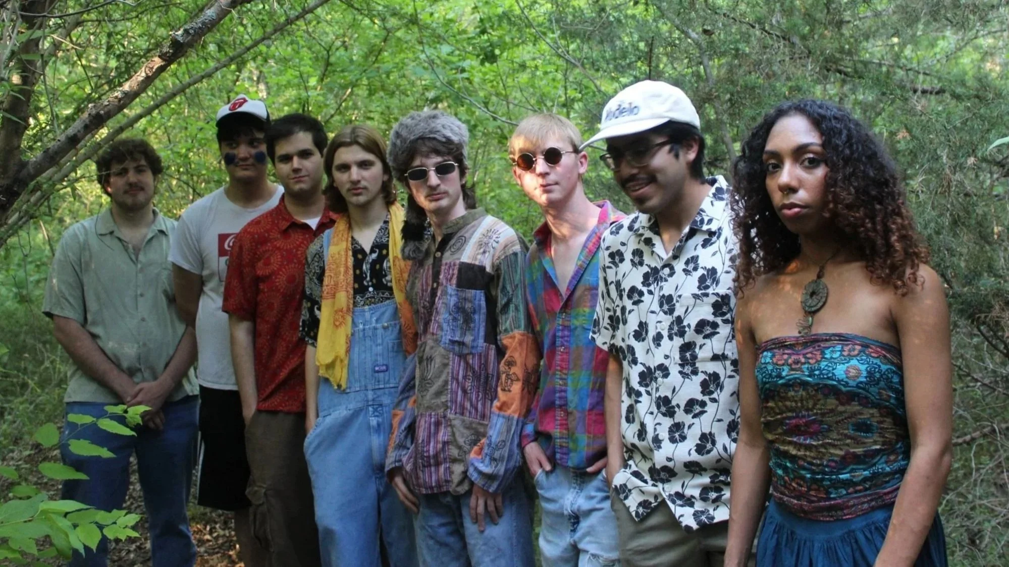 Tabasco Birds standing in a wooded section of Clear Creek Park, Denton TX (May 2026). Photo credit to Rania Geraghty. | Denton's premiere cosmic country band. 'Cosmic American Music' available on all streaming platforms. LPs/CDs. Flying since 2024!