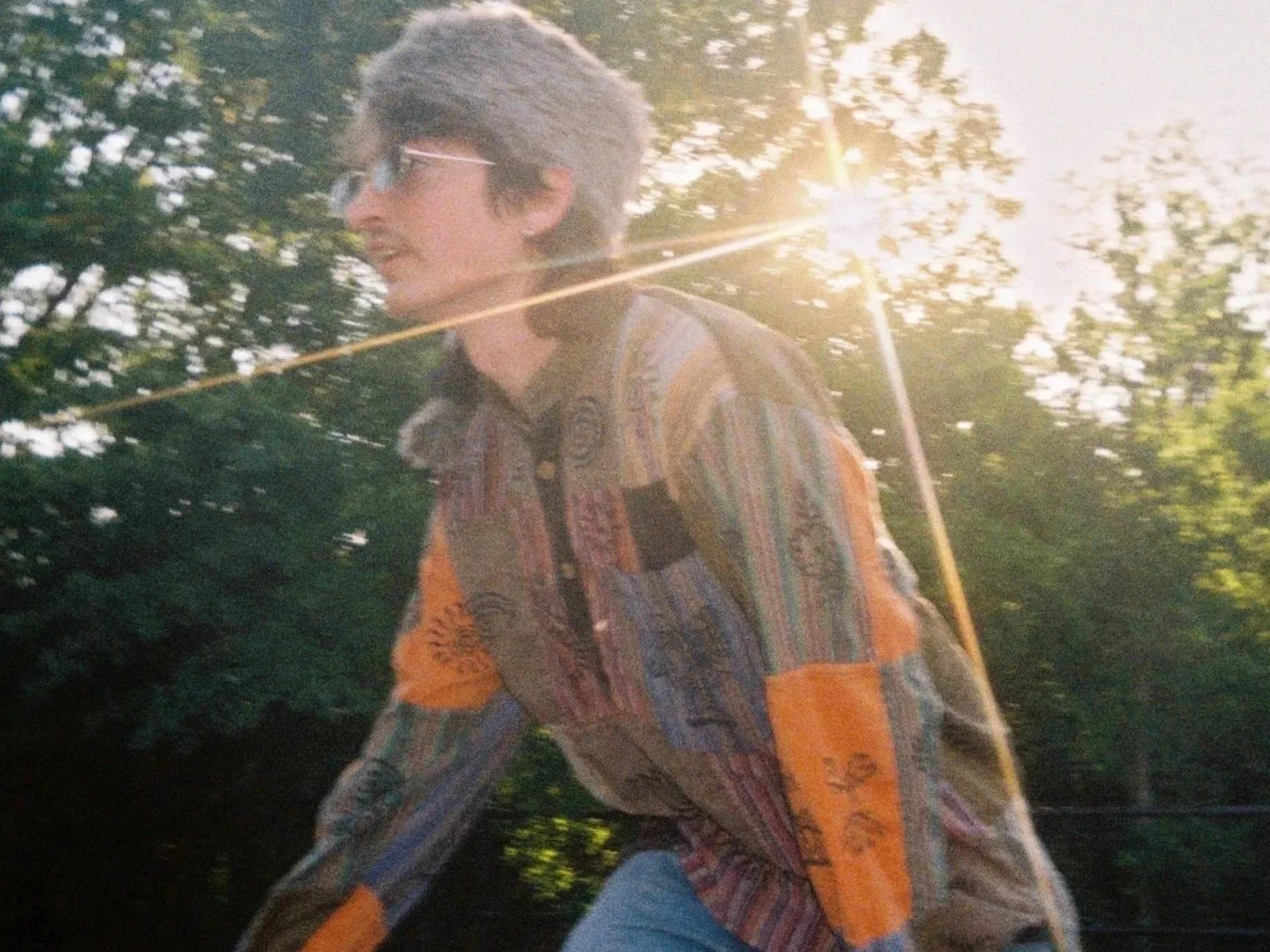 Logan Bolen dressed like a fur tradesman during photoshoot, Clear Creak Park (May 2026). Photo credit to Rania Geraghty. | Denton's premiere cosmic country band. Music available across all streaming platforms. LPs/CDs. Flying since 2024!