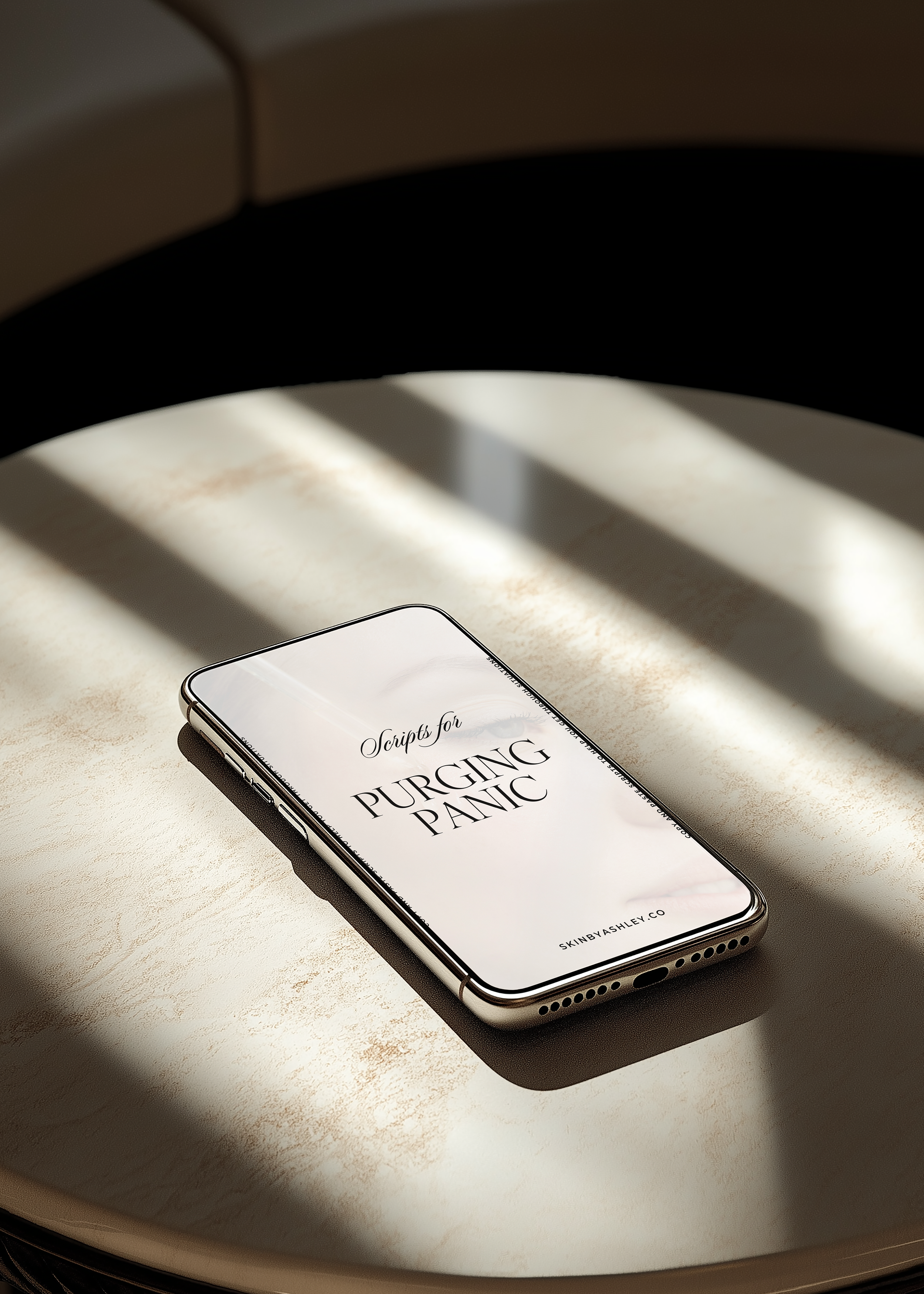 Smartphone on a beige table with sunlight and shadows, displaying the text 'Script for PURGING PANIC' from skinbyashley.co.
