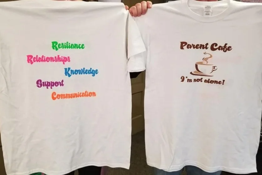 two tshirts one with Parent Cafe I'm not alone and the other with the Five Protective Factors