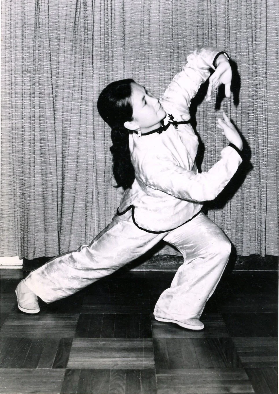 Young Bow Sim Mark demonstrating Chinese martial arts in an early black-and-white photograph.