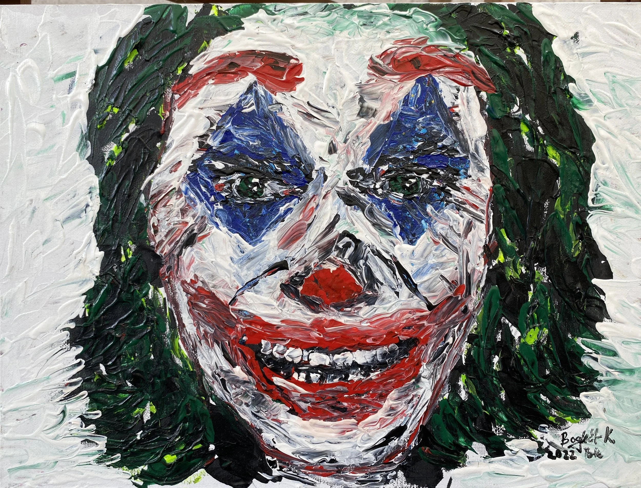 An abstract painting of a person's face, resembling Joker, created with thick, textured brushstrokes. The face has blue eyes, red lips, and white face paint, with a dark background and green elements on the sides.