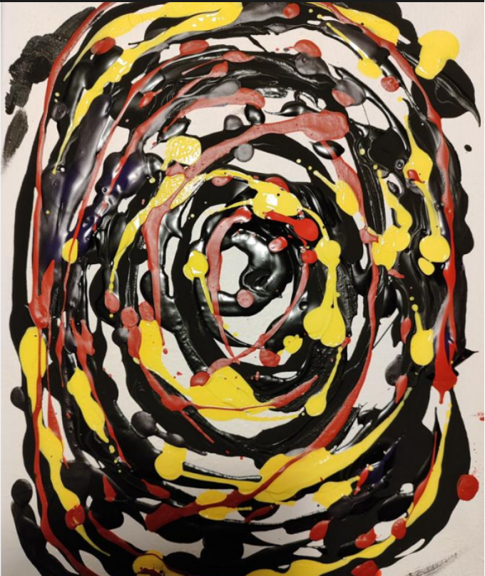 Abstract swirl of black, yellow, red, and gray paint splatters in a spiral pattern on a white background.