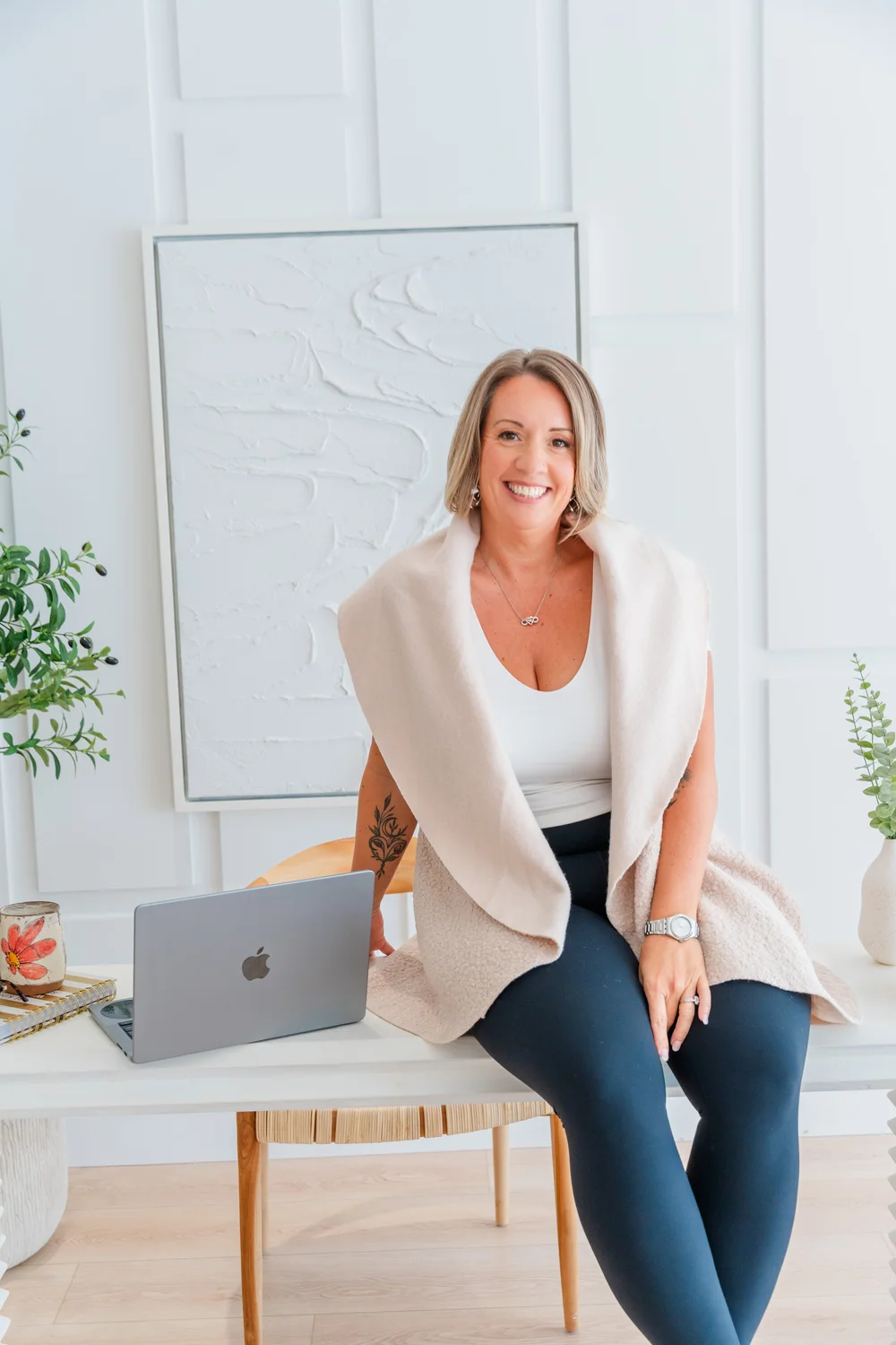 Nicole Mayo, Soul Shift lifestyle coach and founder of The Soul Space, smiling in a bright office in Panama City