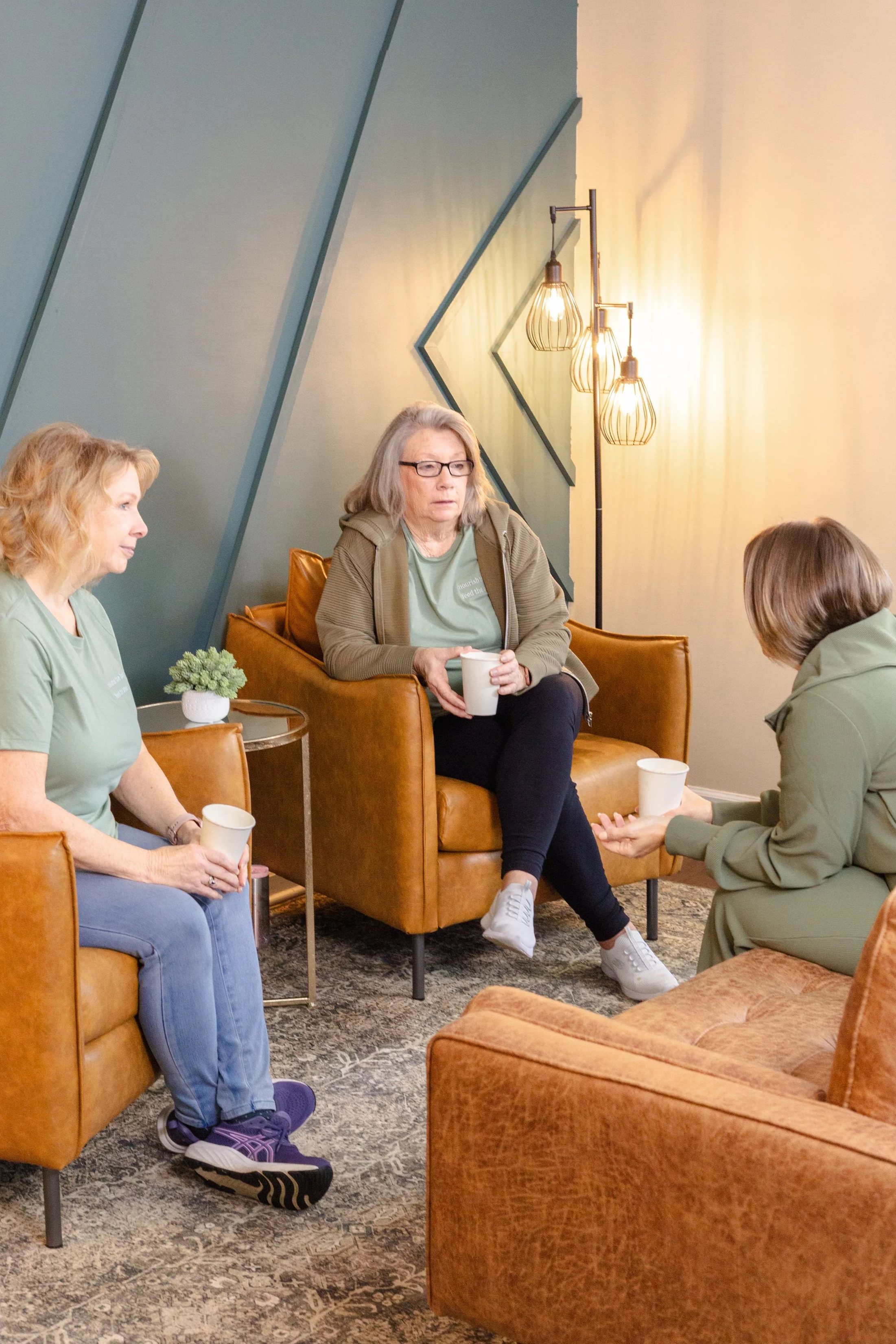 Guests enjoying coffee and conversation inside a Panama City Florida wellness café