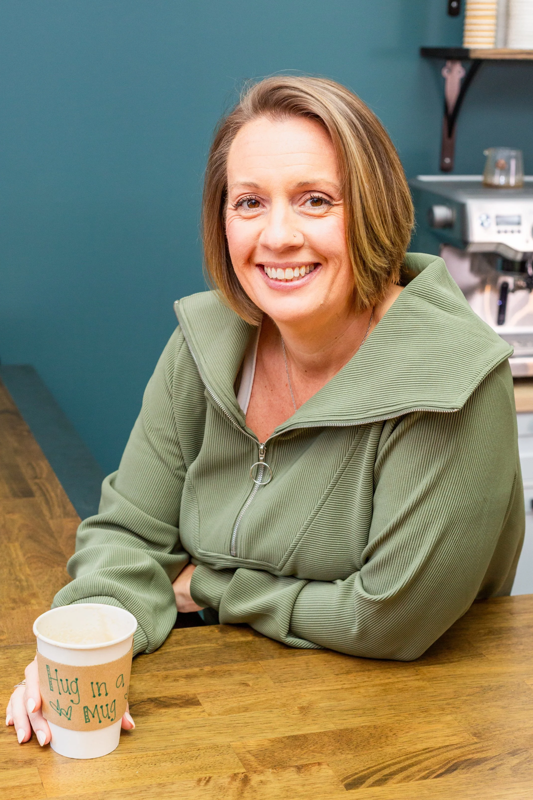 Coffee shown owner and founder enjoying coffee inside a Panama City Florida wellness café focused on community and intentional living