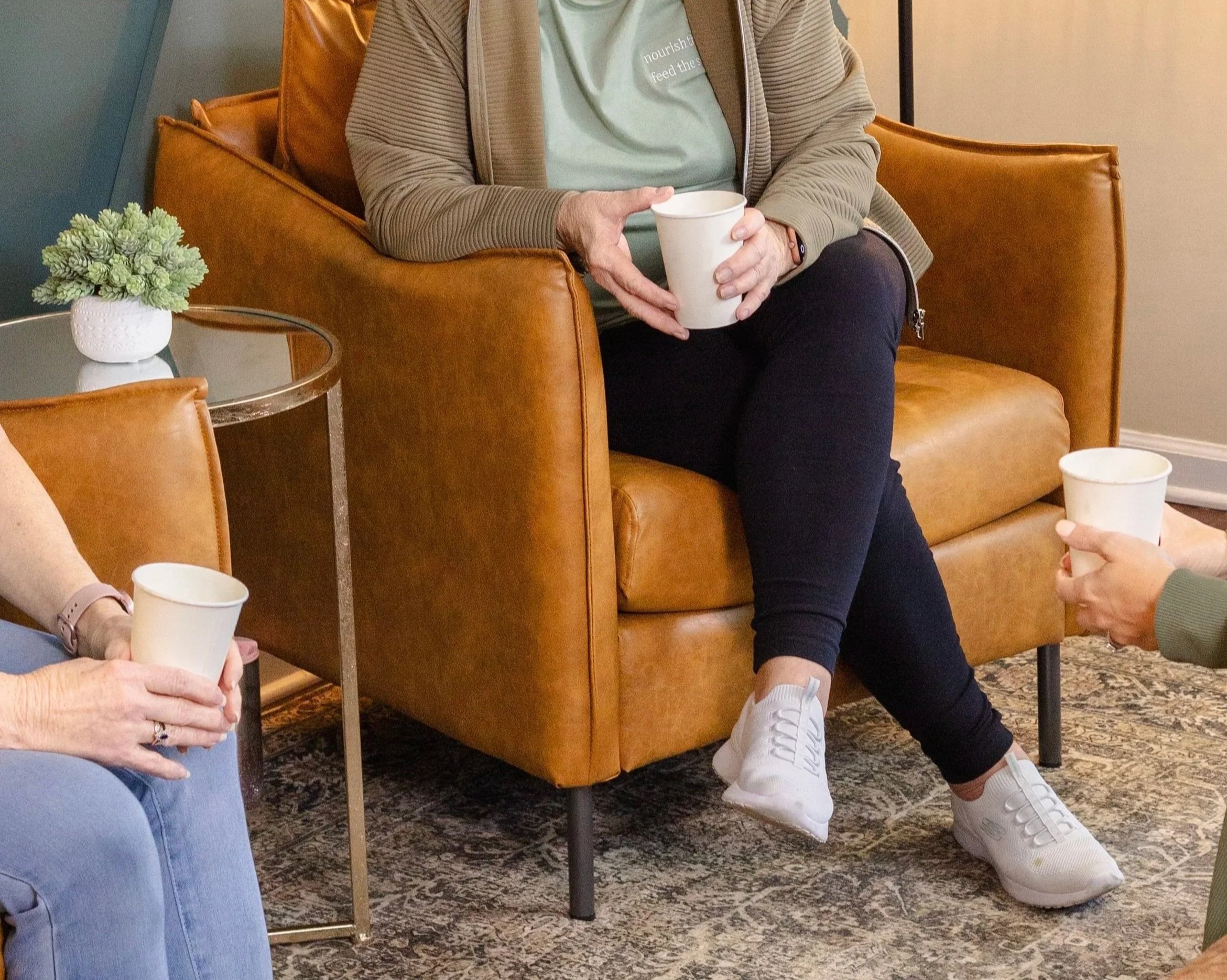 Customers relaxing with coffee inside a Panama City Florida coffee shop and wellness café