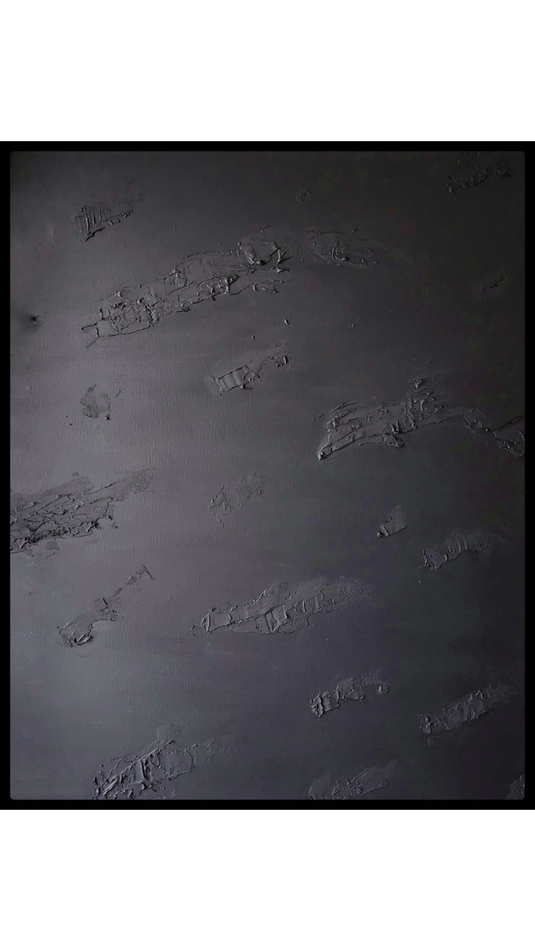 Large matte black abstract painting with textured surface suggesting motion, gravity, and quiet intensity.