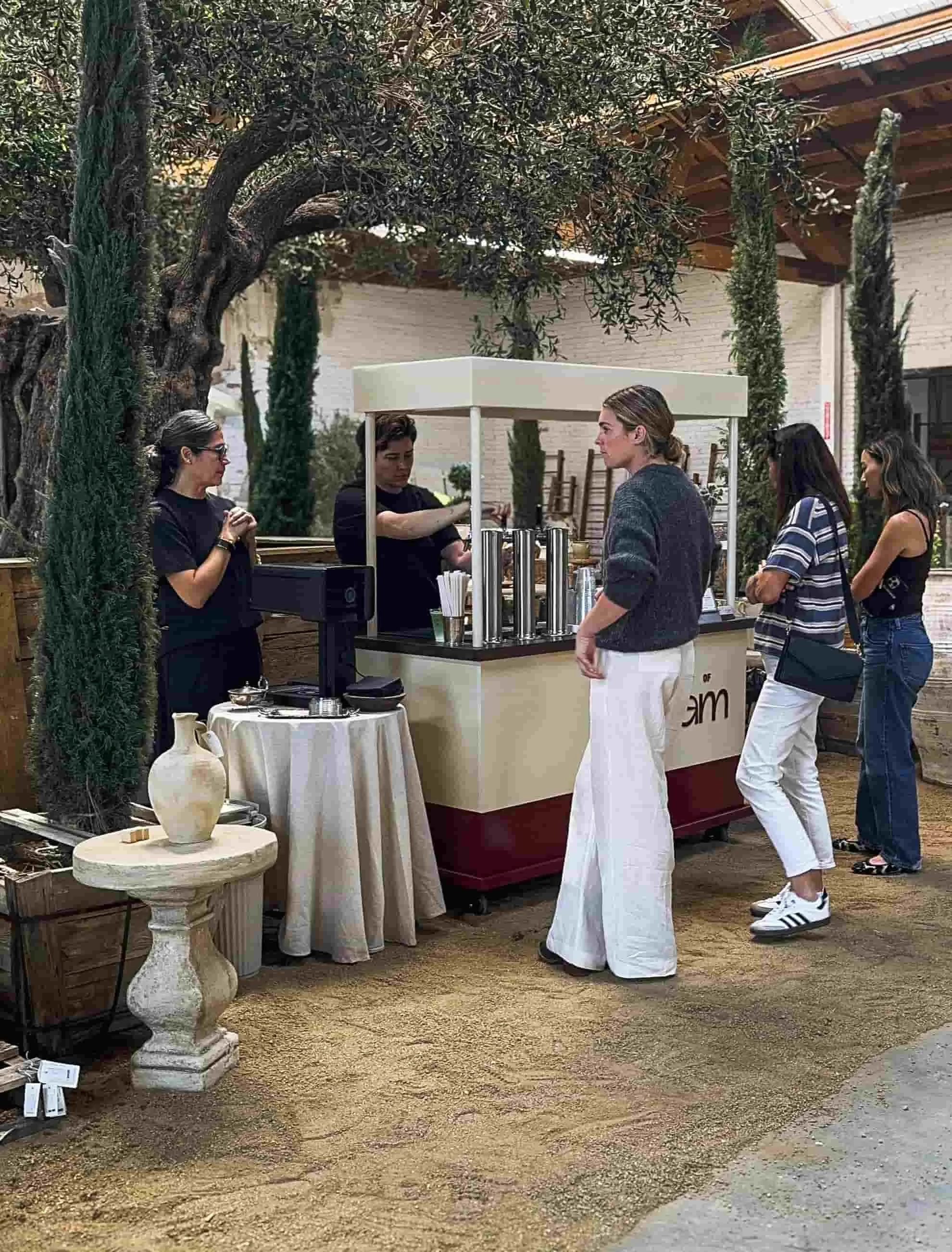 The Art of Roam serving guests from a mobile coffee and matcha cart at a Los Angeles event
