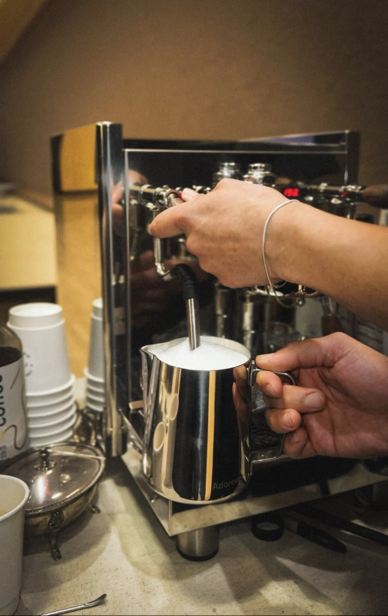 Barista preparing espresso drinks for The Art of Roam mobile coffee catering