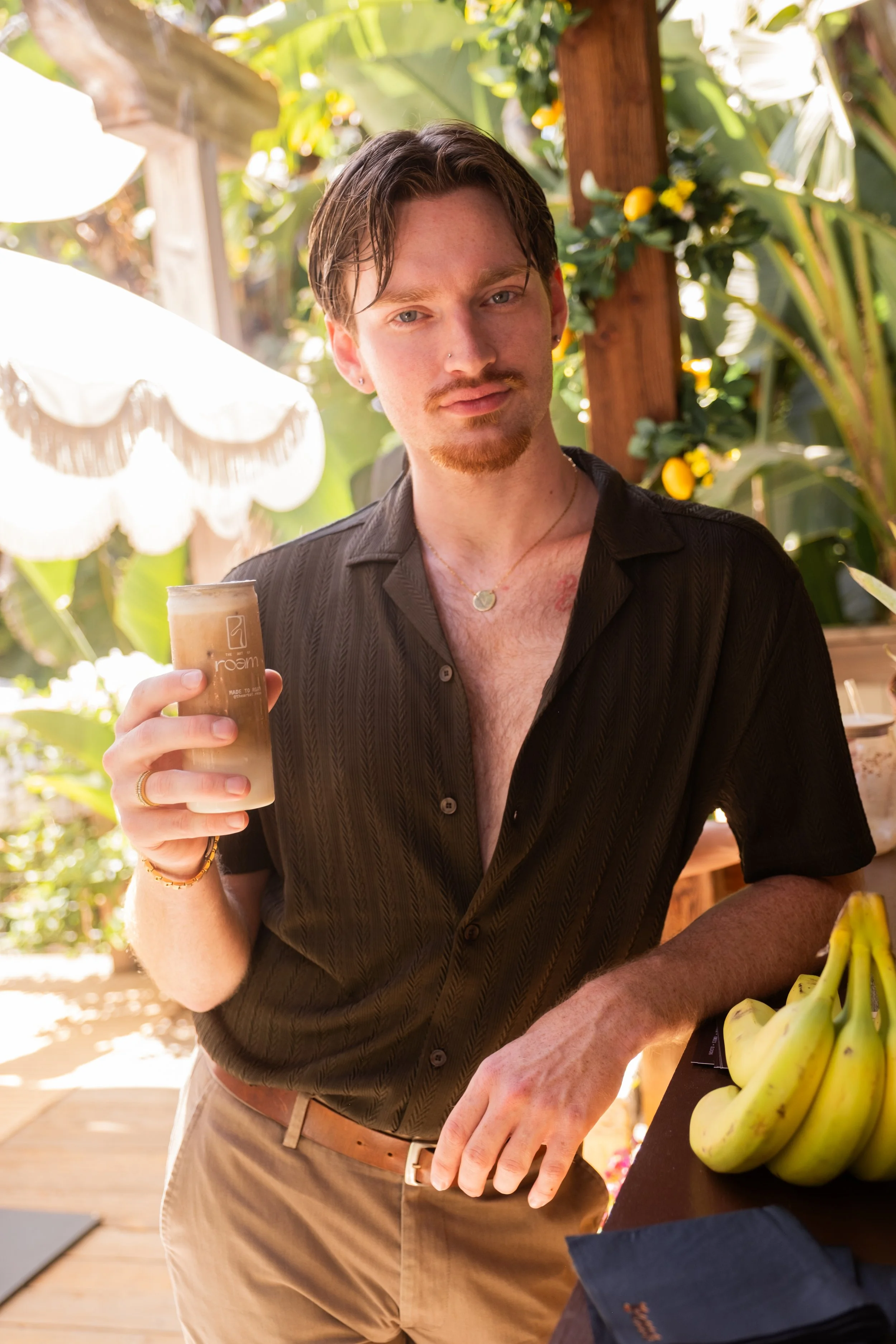 Guest holding a handcrafted Roam canned beverage during a Posse LA brand activation.