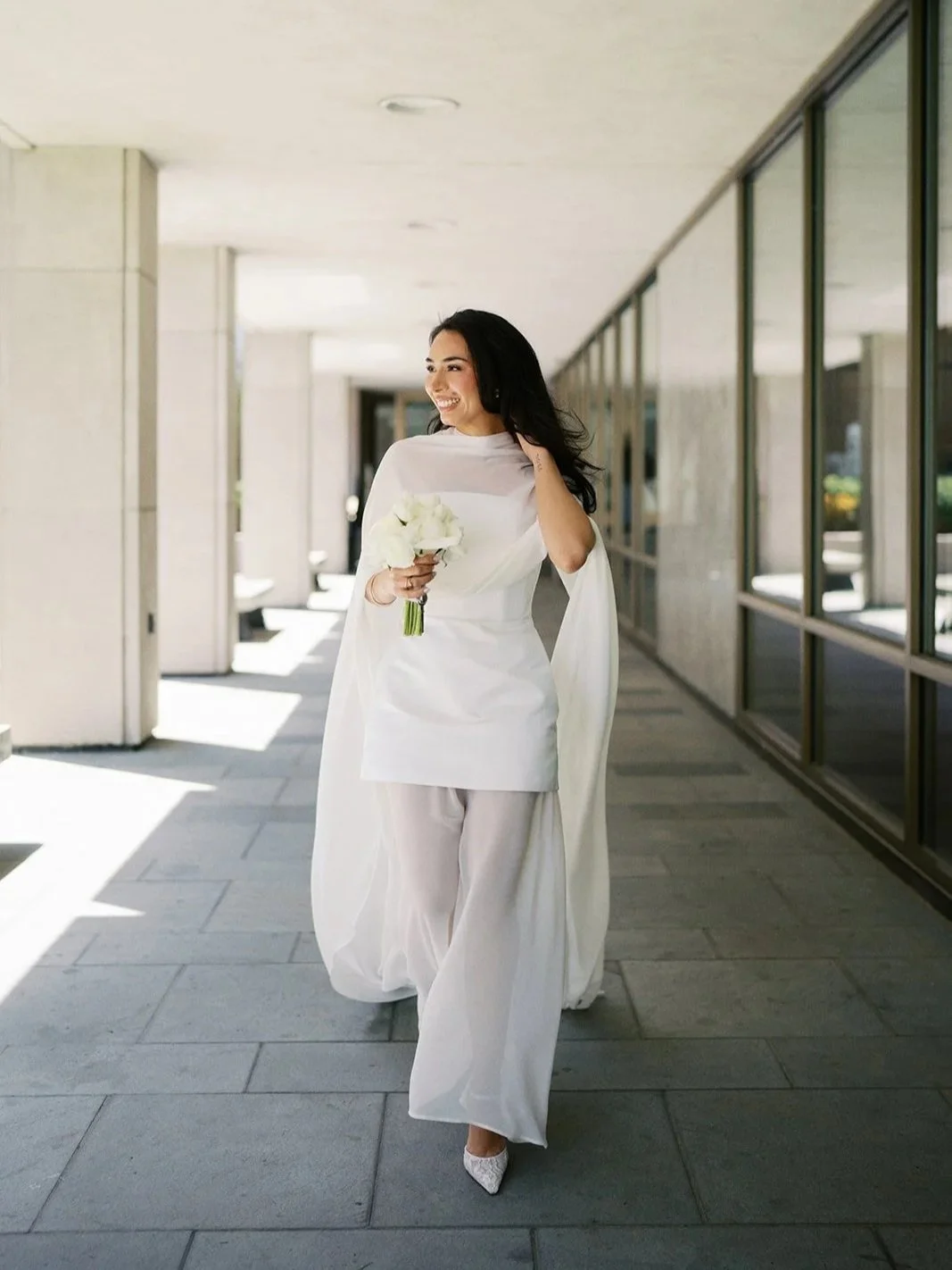 bride walks near west chester courthouse in pennsylvania