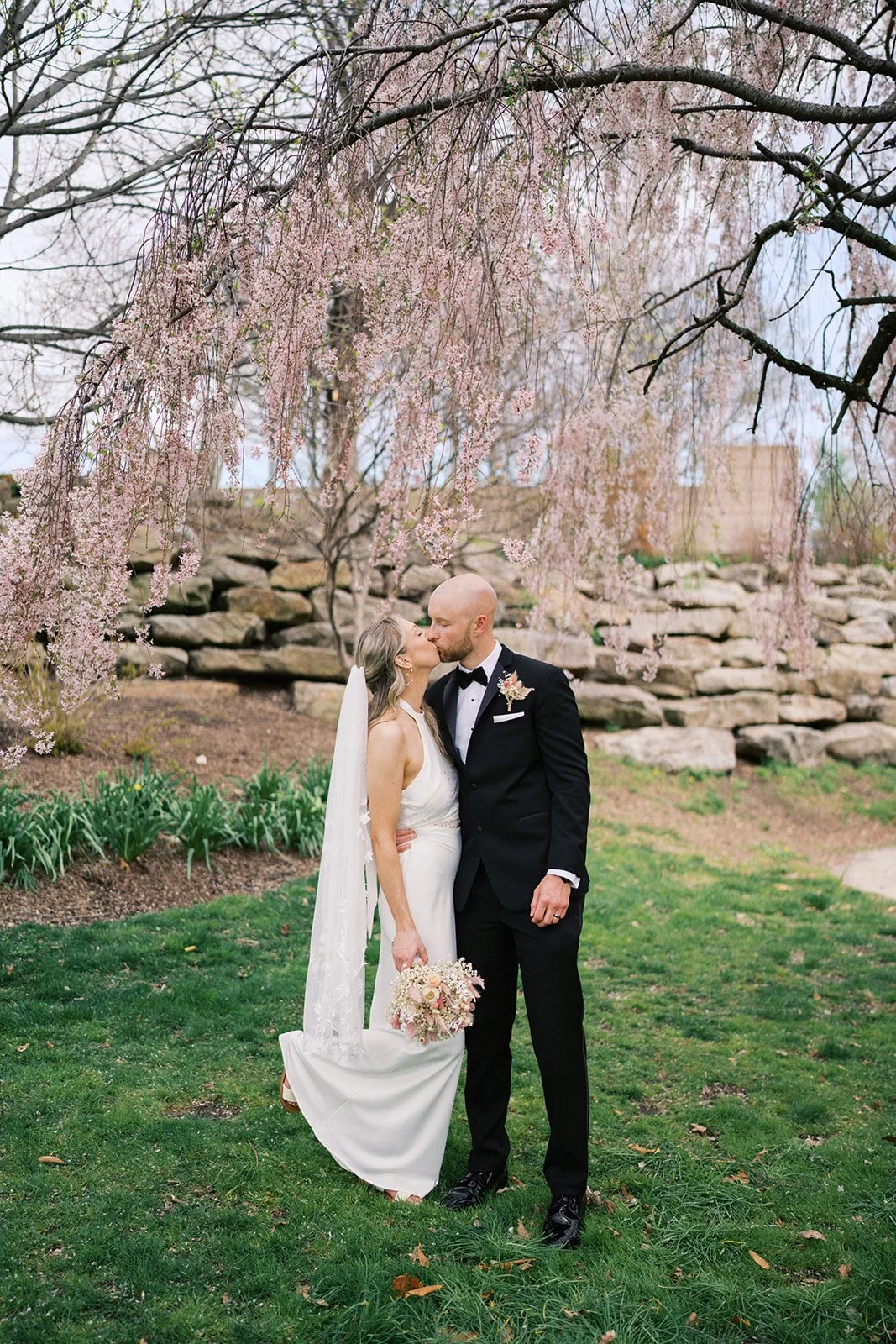 bride and groom kissing during elopement celebration in fairmount park, philadelphia