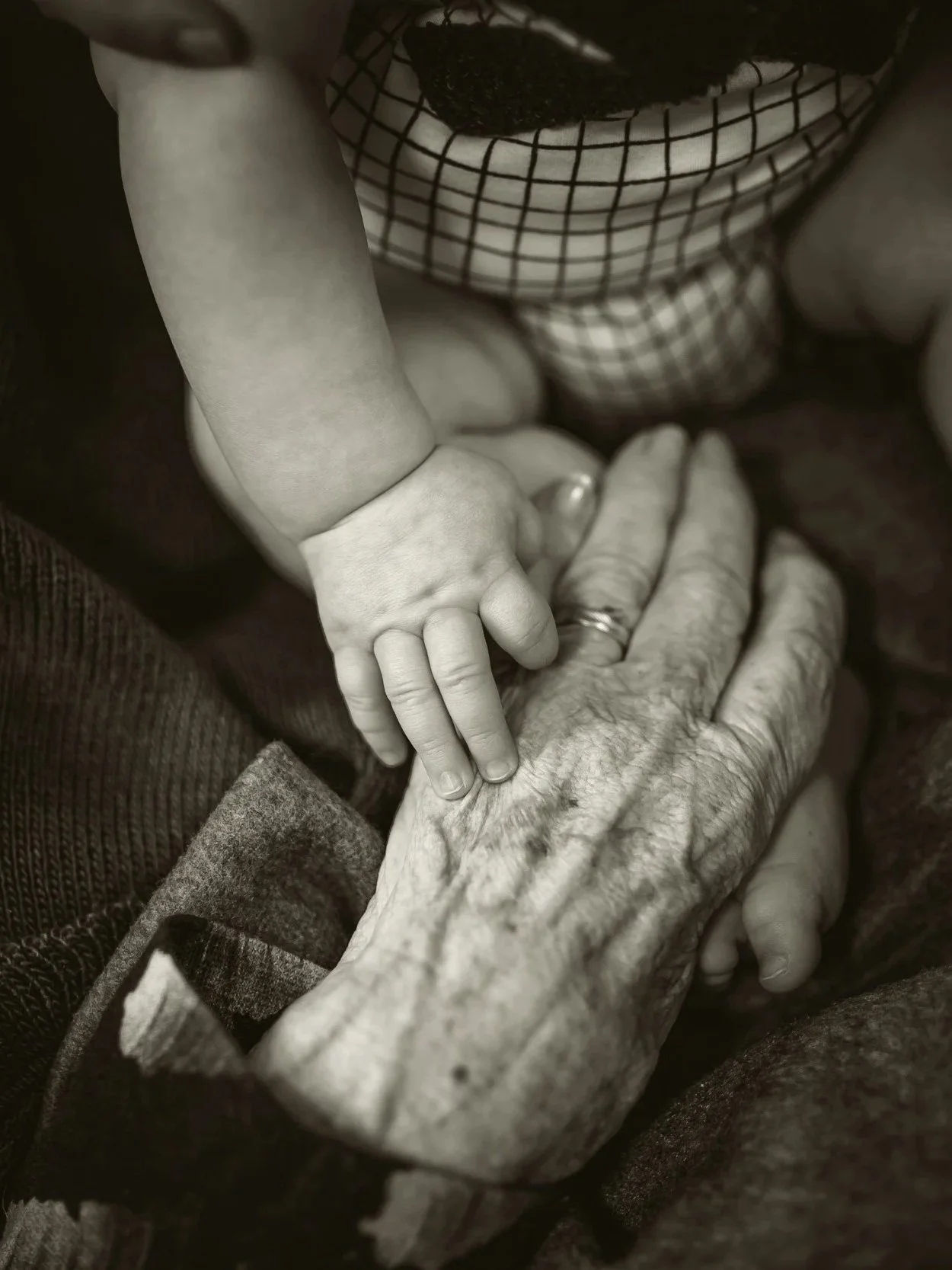 Person sitting quietly in reflection, representing somatic therapy for intergenerational trauma