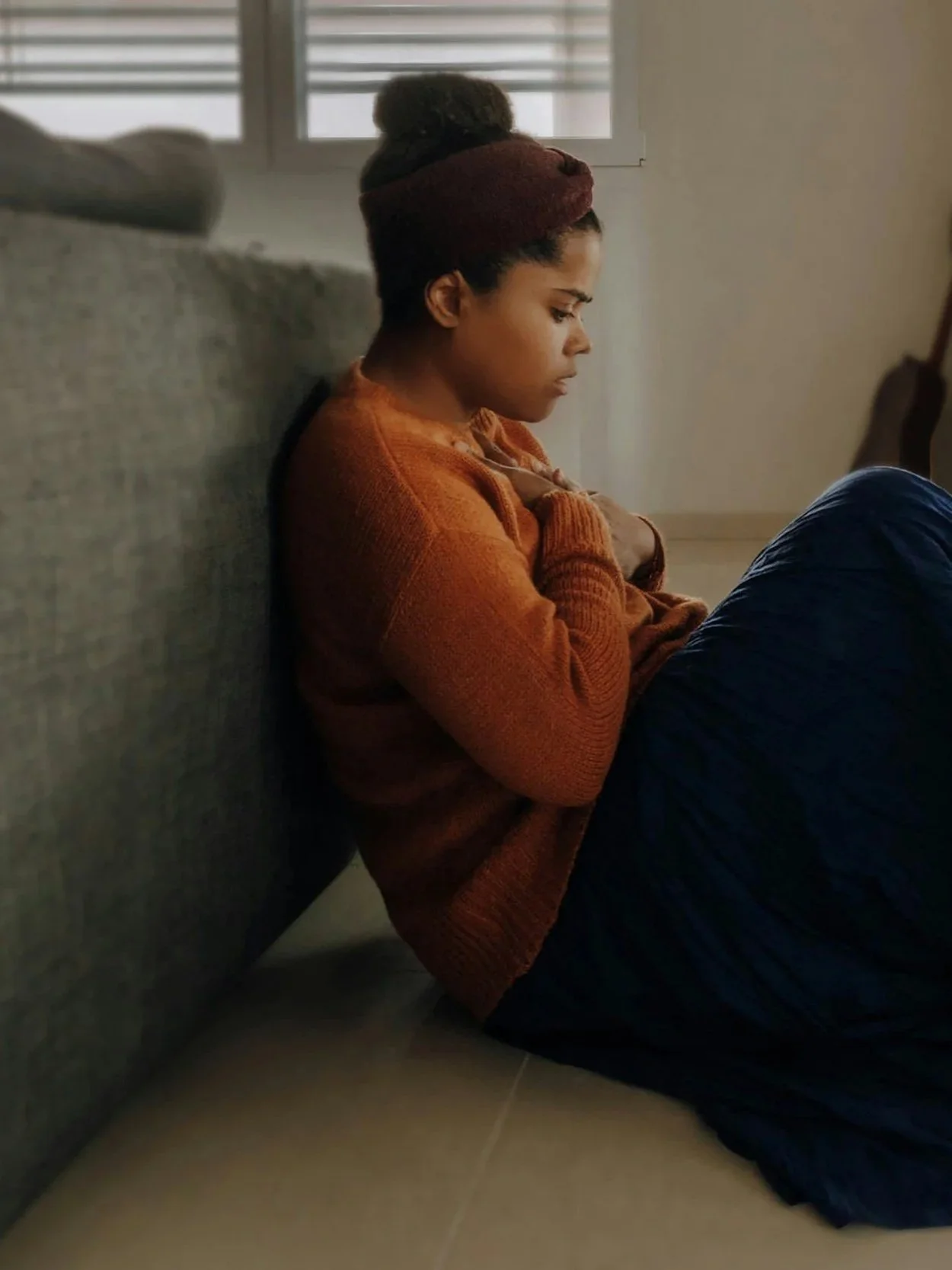 Person pausing amid a busy moment, representing somatic therapy for anxiety and perfectionism