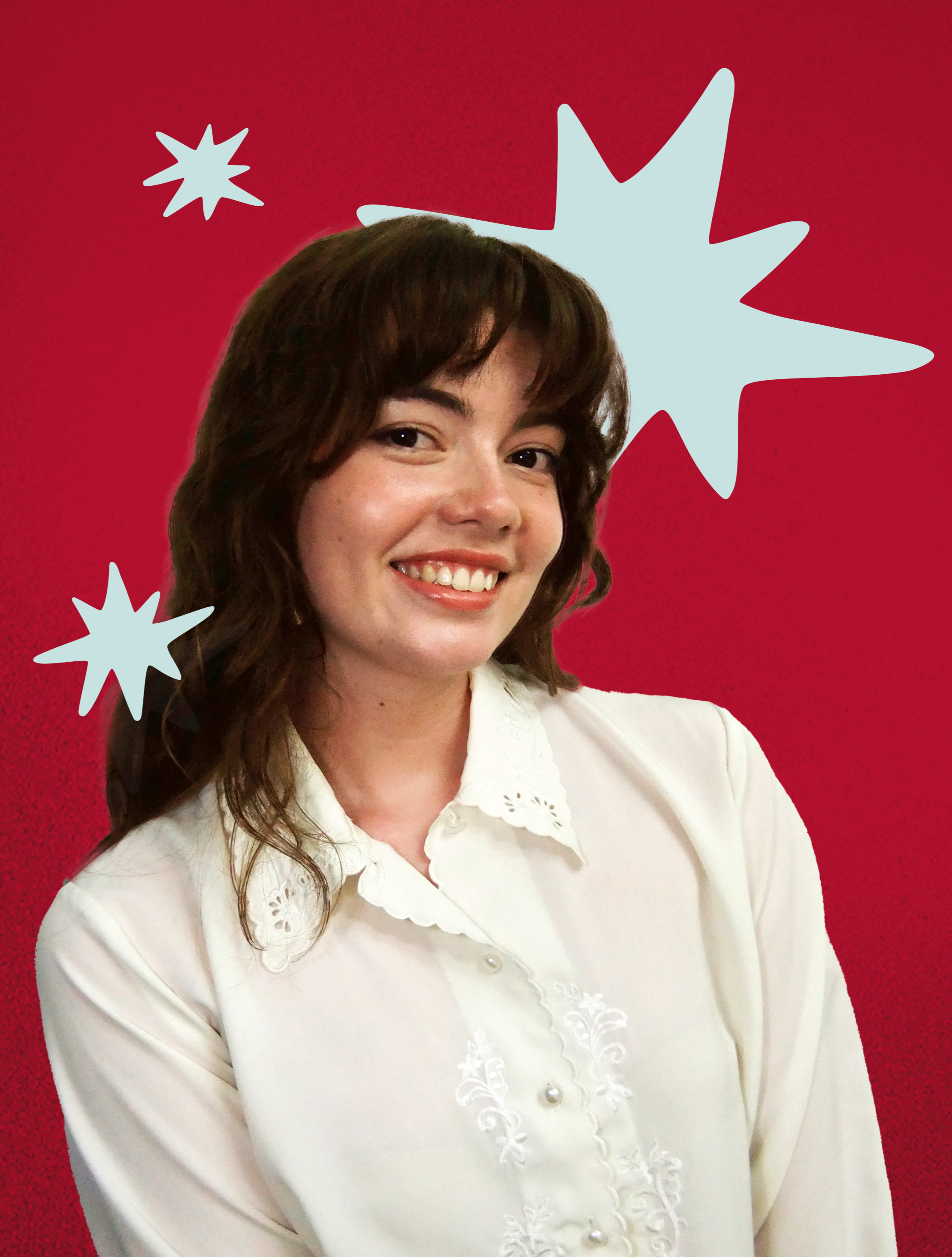 Photograph of a professionally dressed brown haired woman in front of a red background