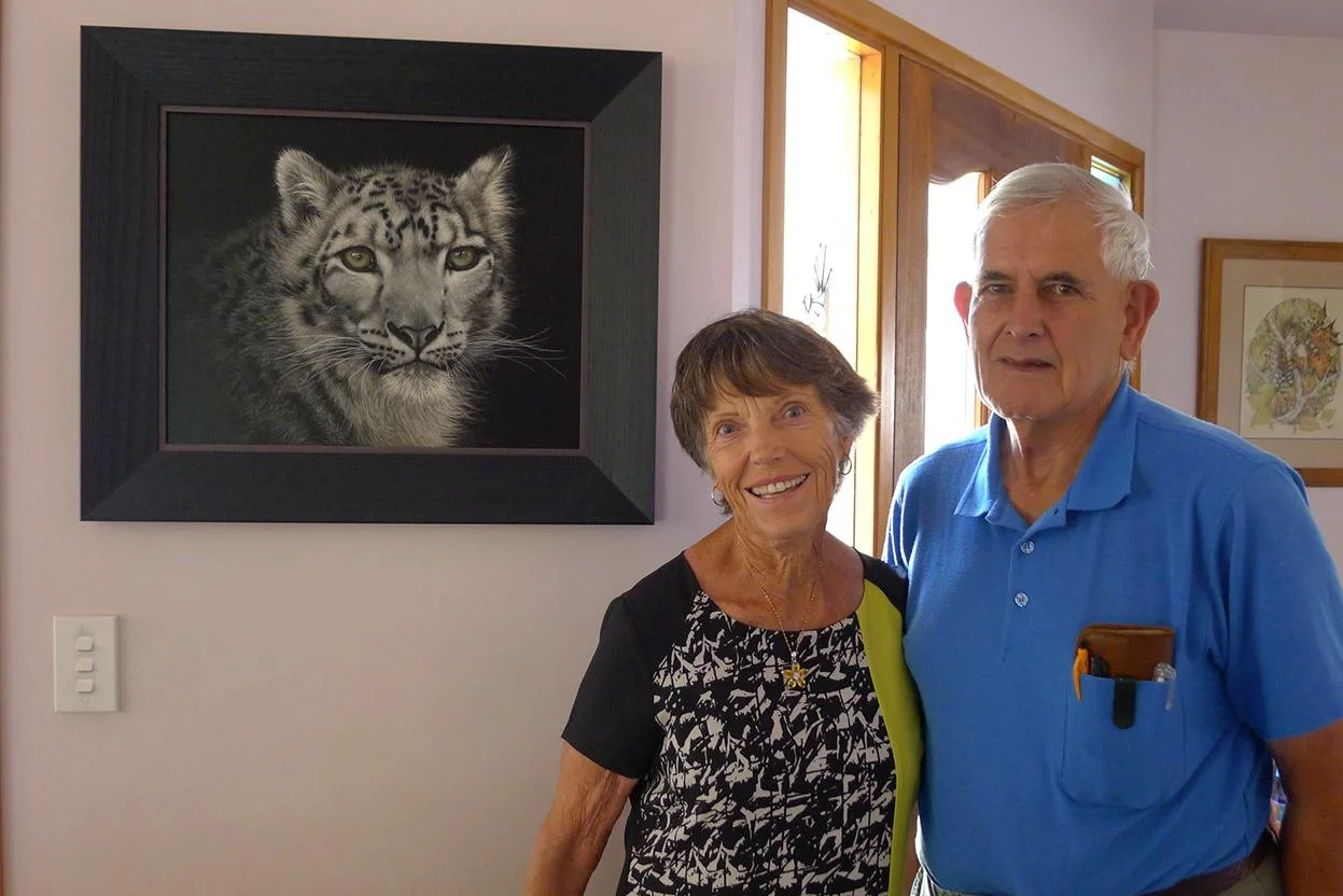 Happy clients in Motueka with a Snow Leopard Scratchboard Artwork. They reported later the eyes always follow them around the room!
