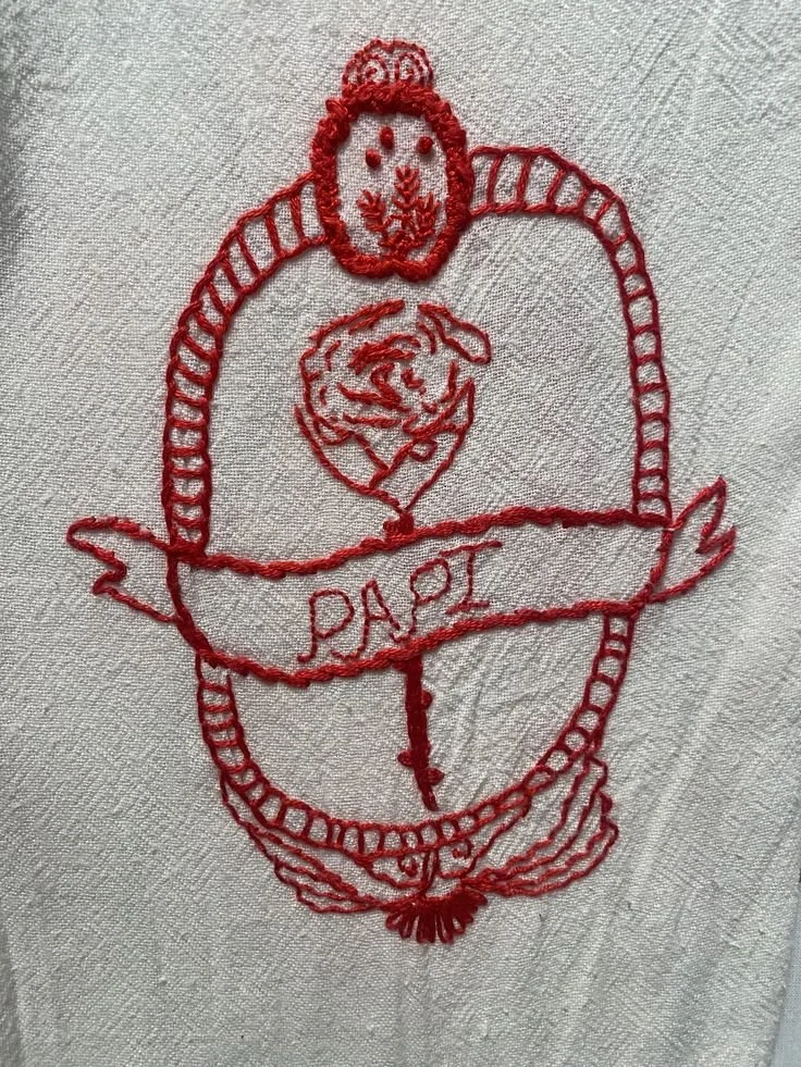 hand embroided papi textile tattoo in red thread.jpg