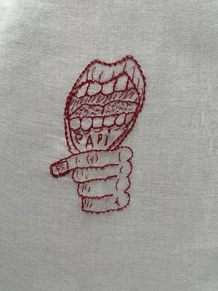 textile tattoo - embroidery in red thread.jpg