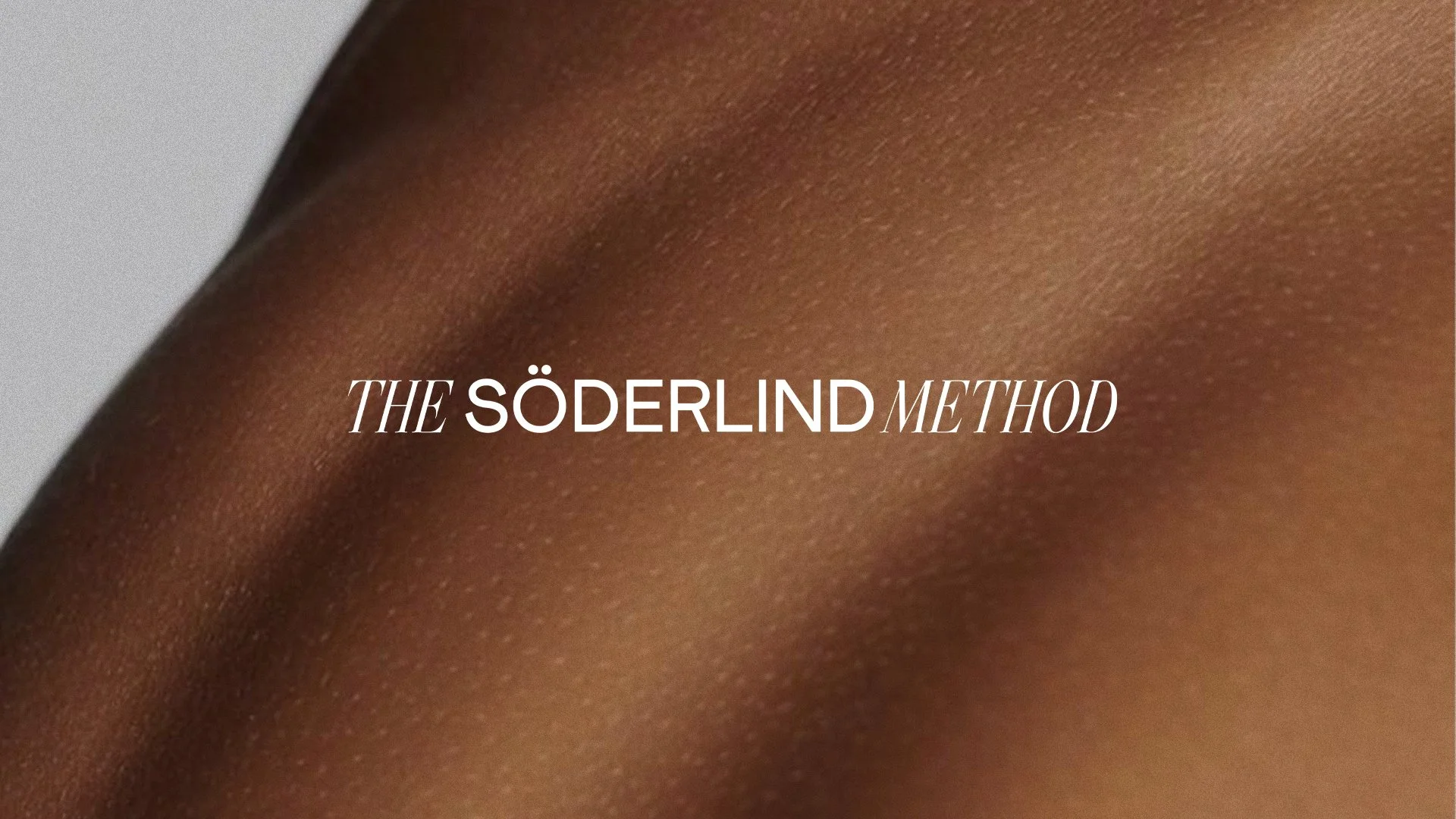Close-up of a person's skin with text overlay that reads 'The Söderlind Method'.