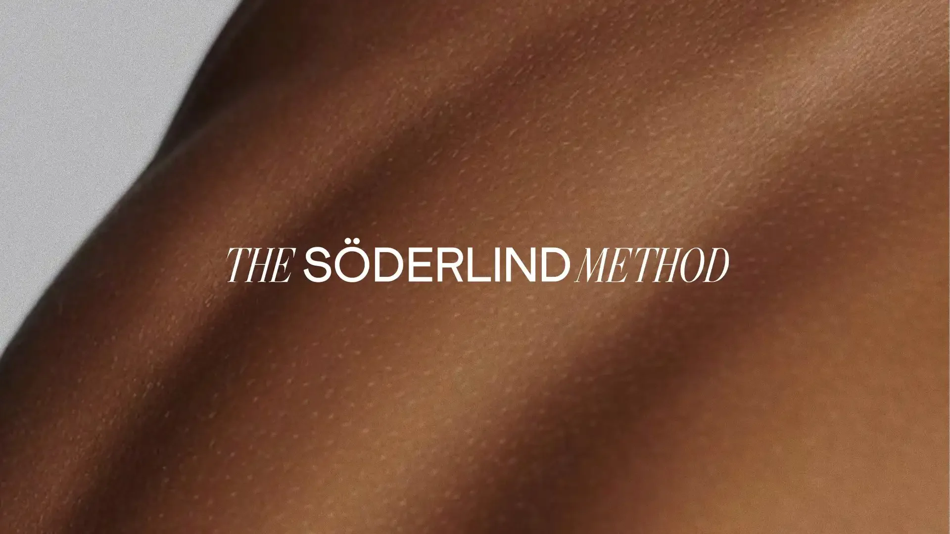 Close-up of a person's skin with text overlay that reads 'The Söderlind Method'.