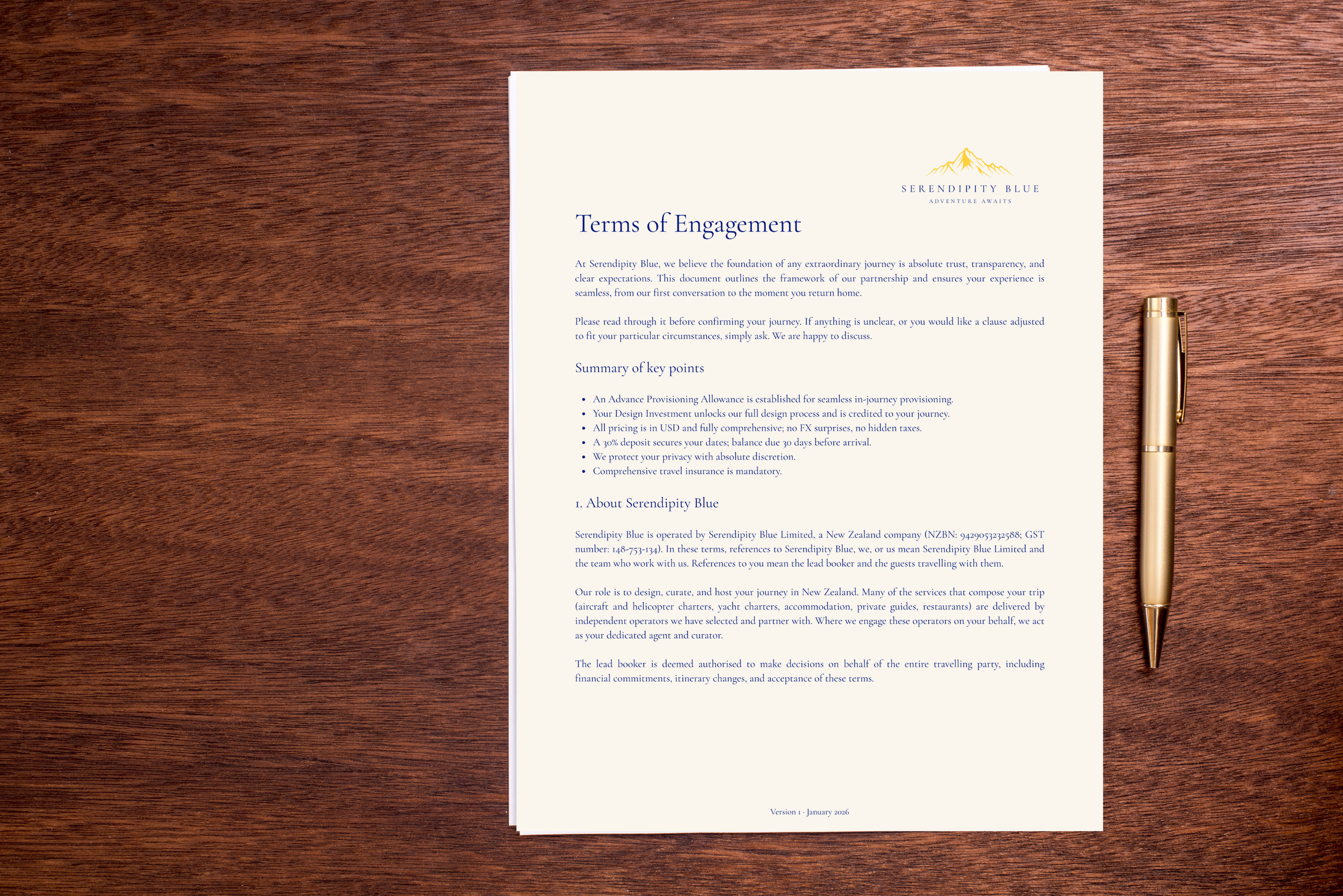 A document titled 'Terms of Engagement' from Serendipity Blue, placed on a wooden surface with a gold pen beside it.