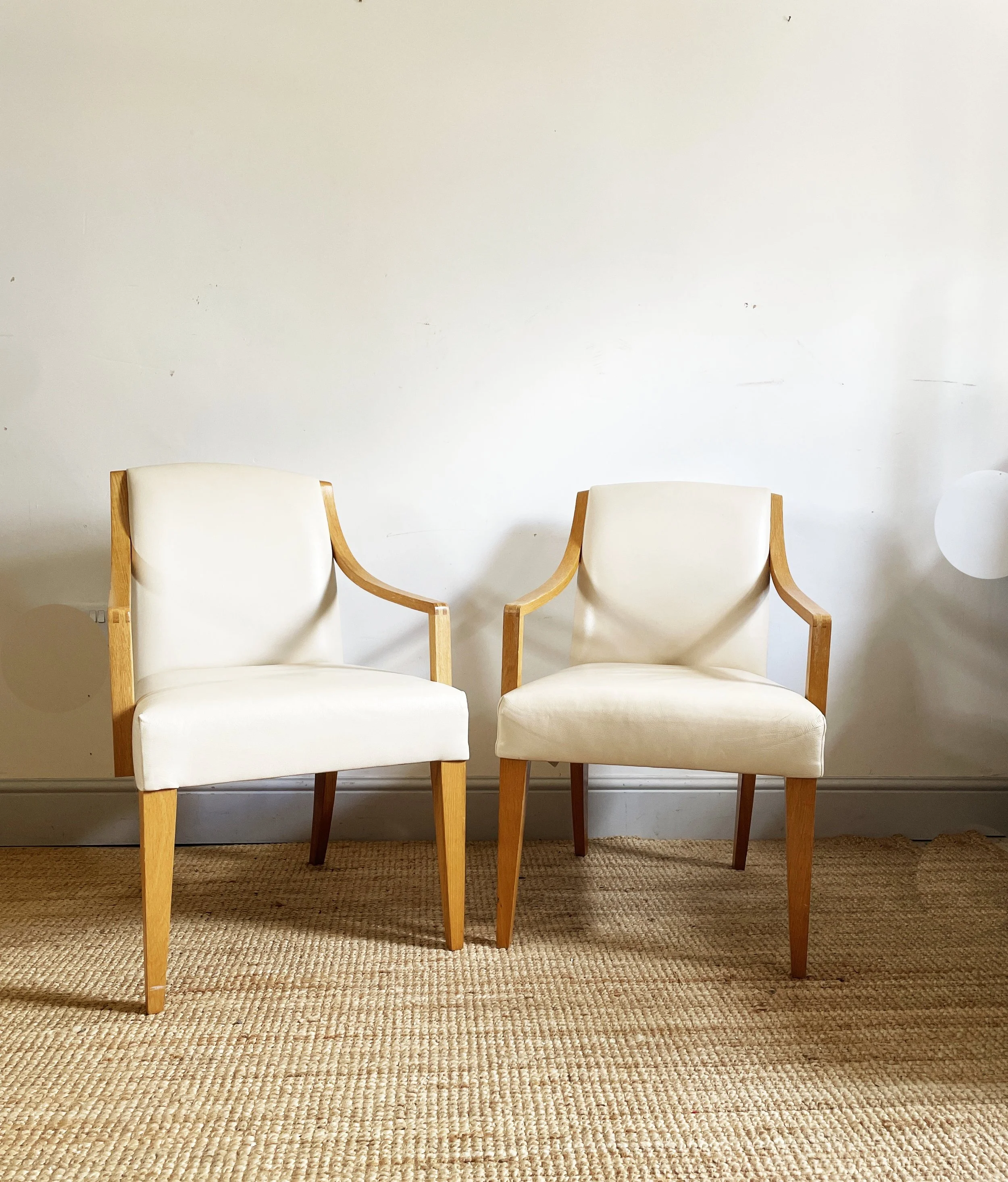 A pair of stylish vintage bentwood and leather dining chairs / armchairs