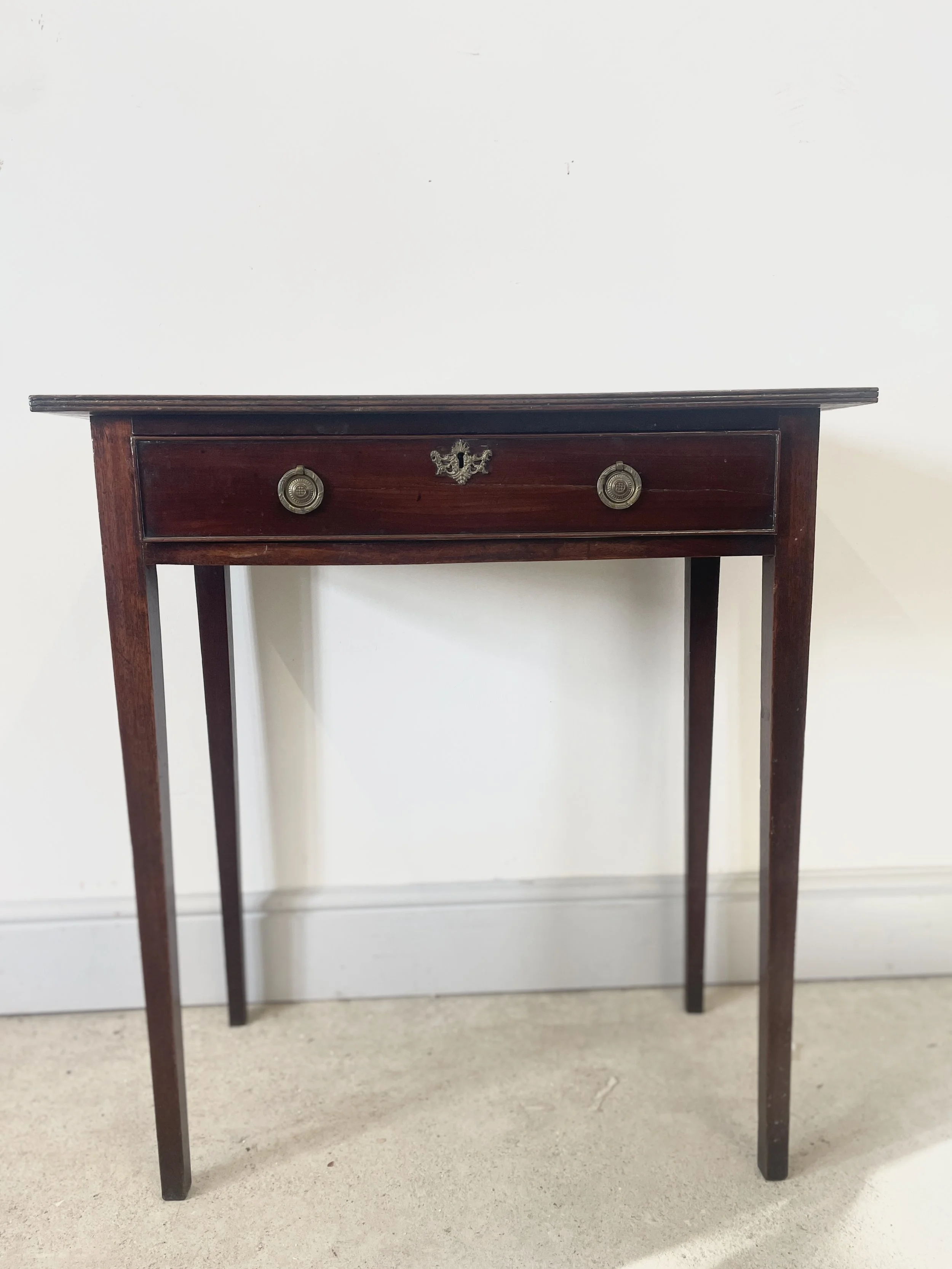 An antique Georgian mahogany side table