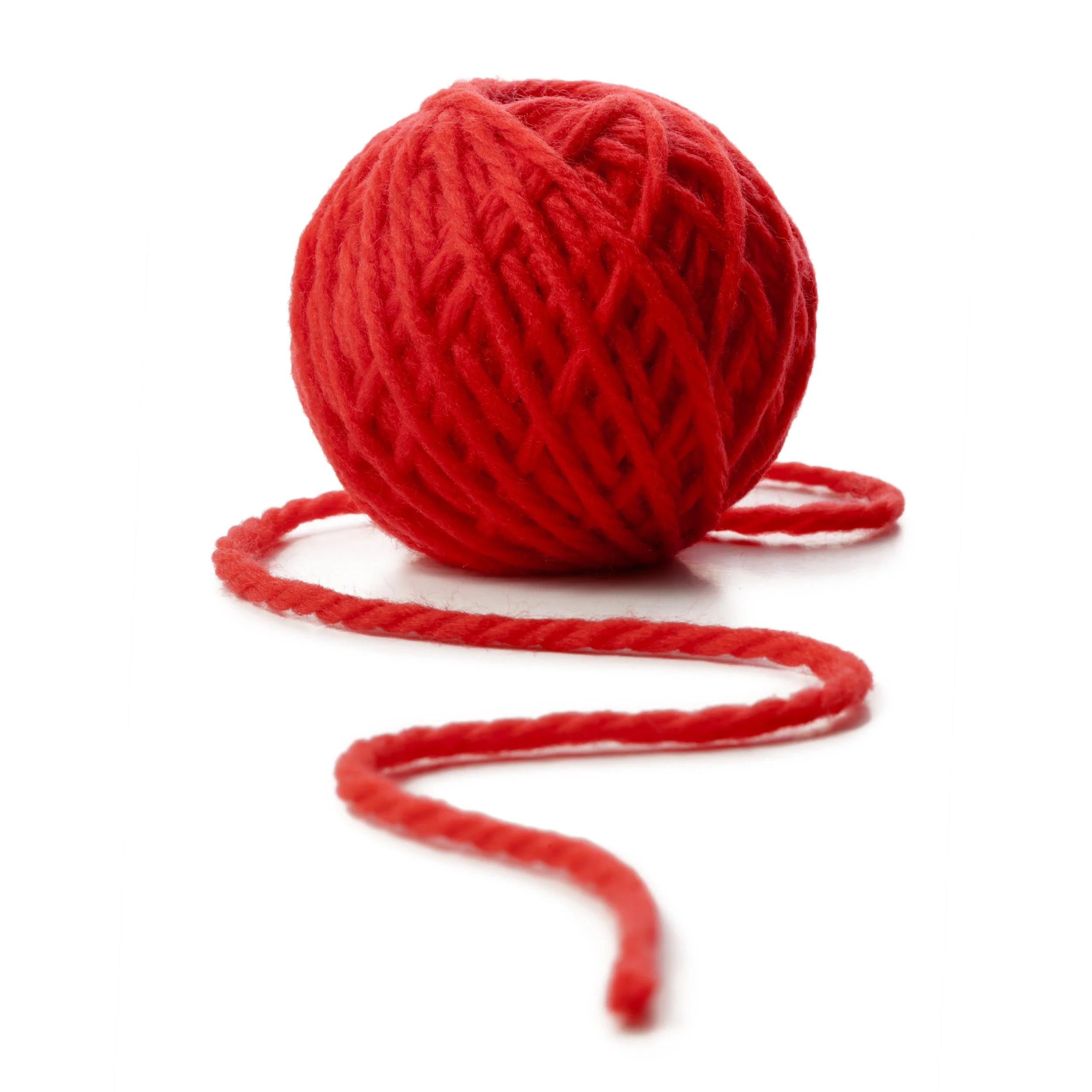Red ball of yarn with a loose end on a white background.