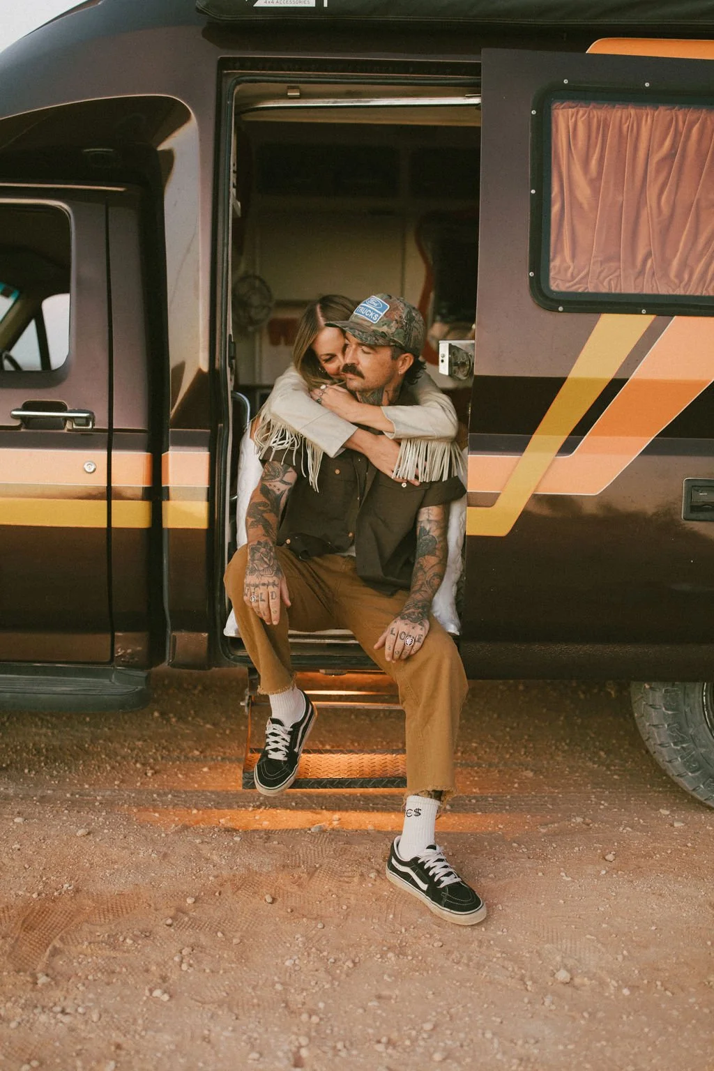 Loved up couple, sharing a moment during a creative photoshoot, captured by Kacie Herd.