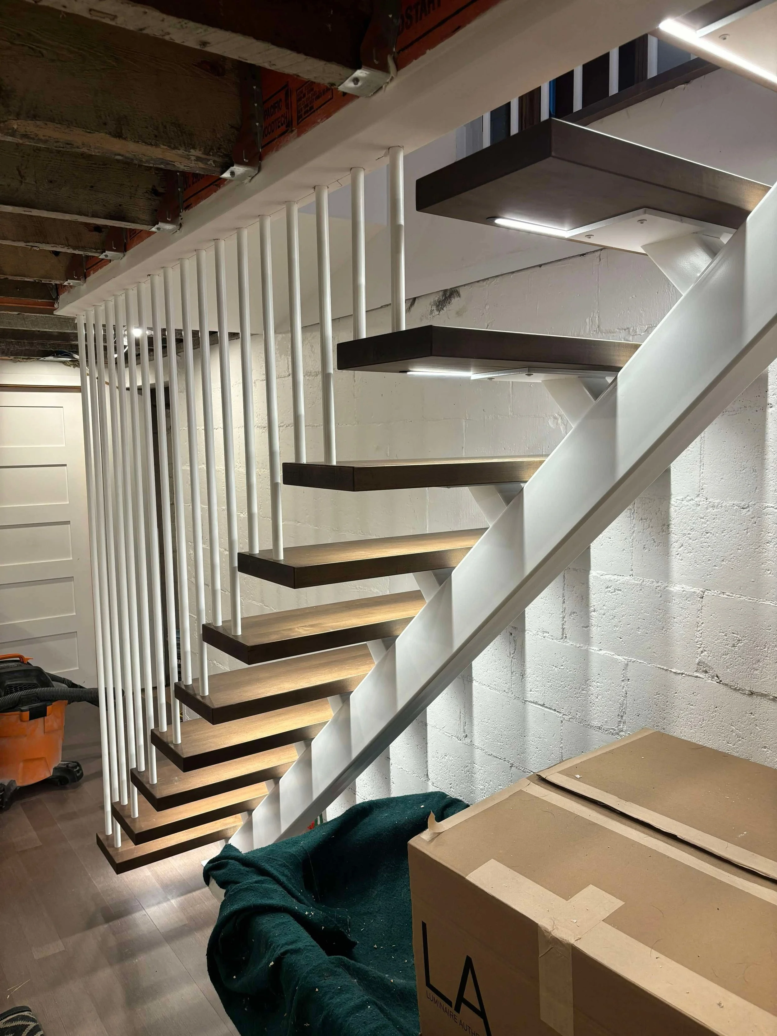 white central stringer with LED lights and white oak treads