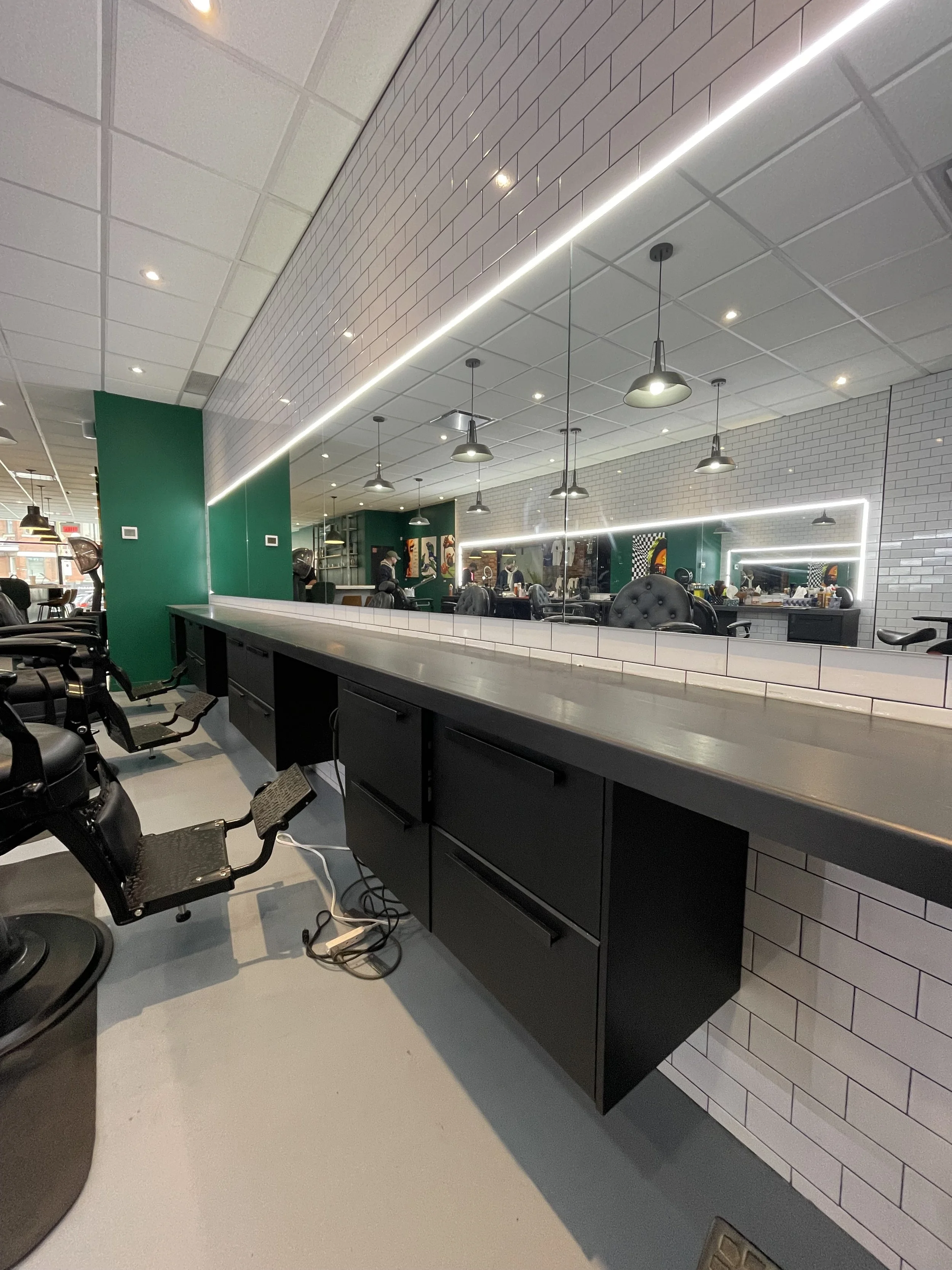 barbershop renovation. custom steel counters and custom mirrors