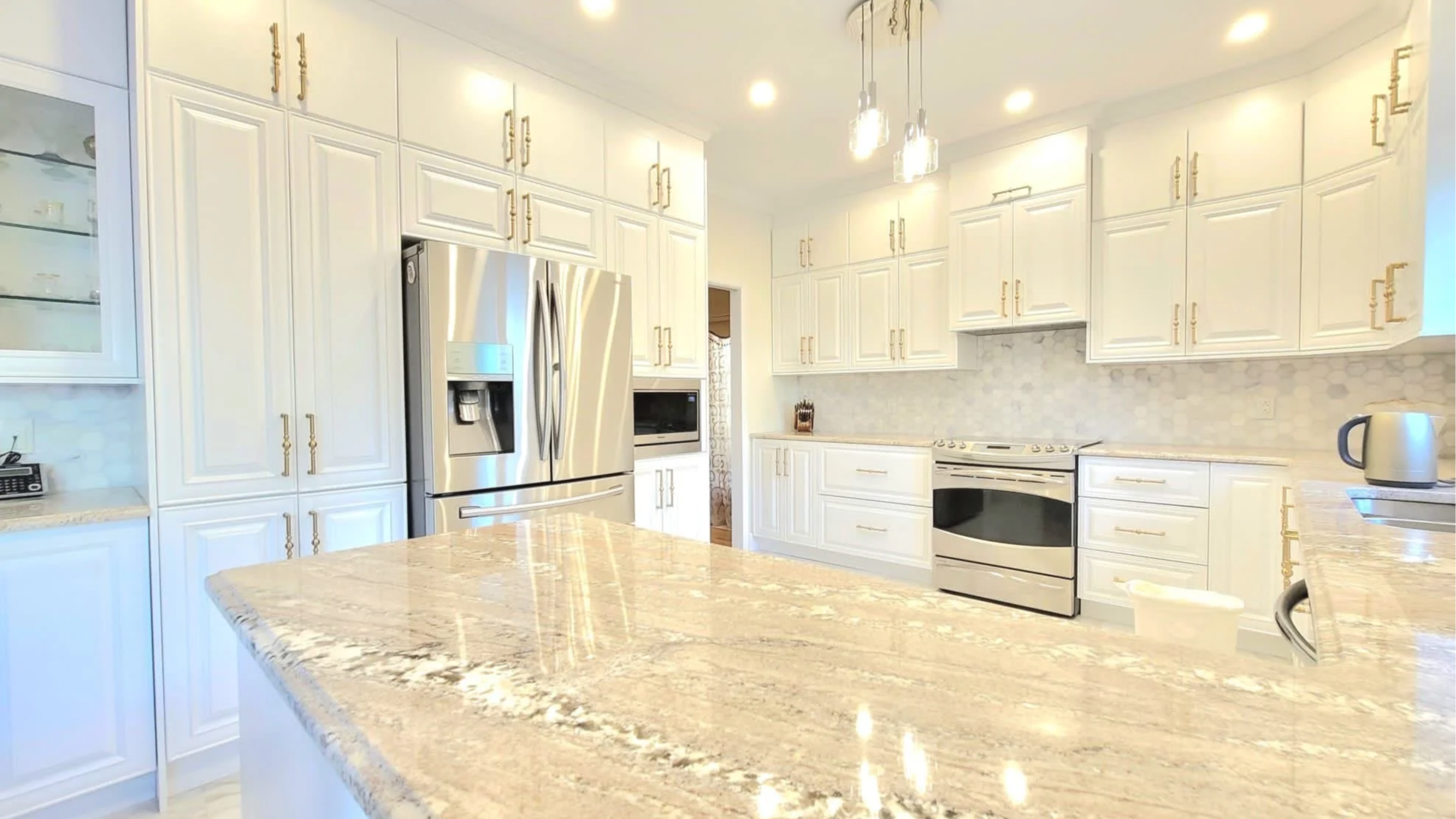 full kitchen renovation. custom white cabinets and quartz counter top