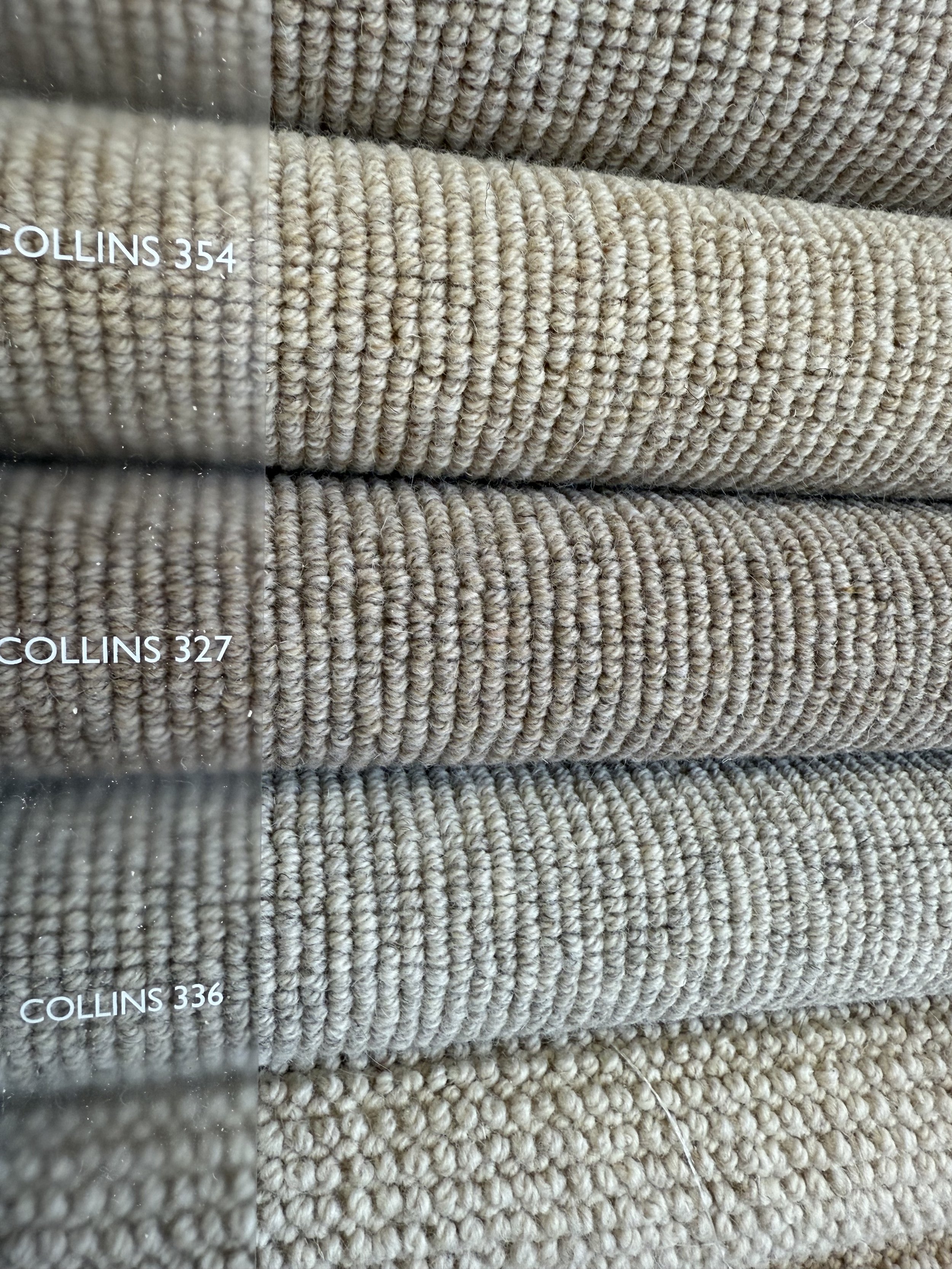 Cormar Carpet - Close-up of beige textured fabric swatches labeled COLLINS 354, 327, and 336.