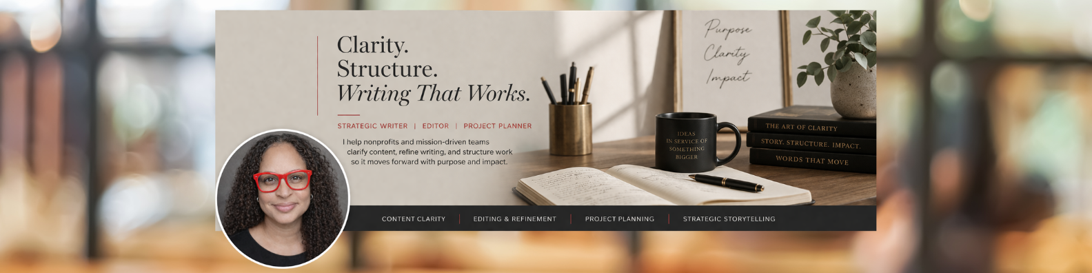 A website banner featuring a woman with curly hair and red glasses on a profile picture, text that says "Clarity. Structure. Writing That Works," and a workspace with a notebook, pen, black mug with gold lettering, a potted plant, and stacked black books with titles related to writing and storytelling.