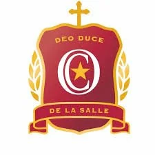 A shield emblem with a gold border, featuring a cross at the top, and laurel branches on either side. Inside the shield, there is a large letter 'C' with a star inside it. The shield has the words 'Deo Duce' at the top and 'De La Salle' at the bottom.