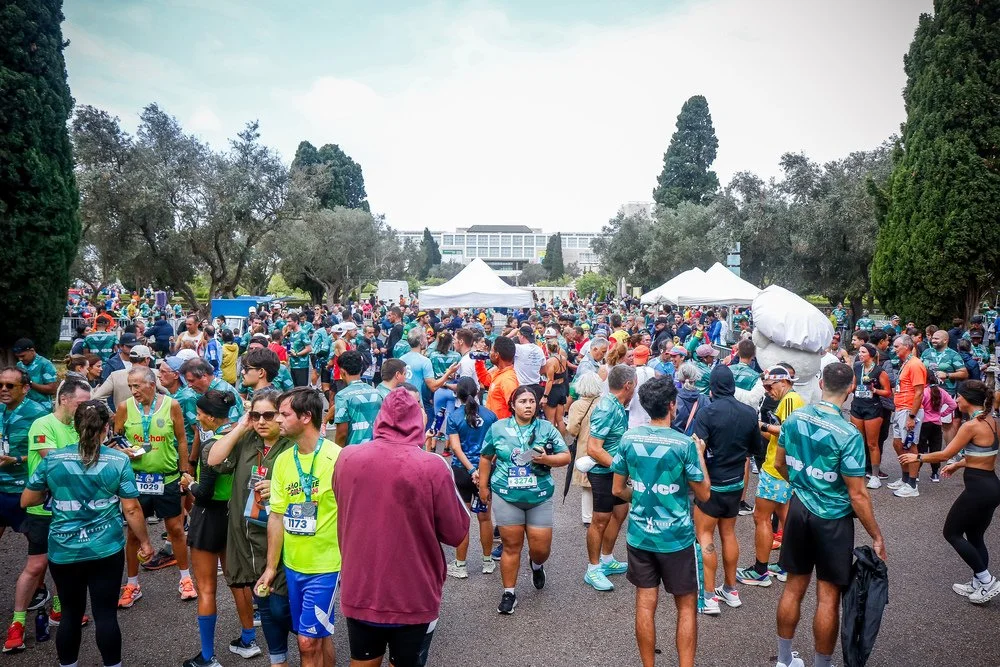 Participants gathering at the event village during the Bimbo Global Race in Lisbon.