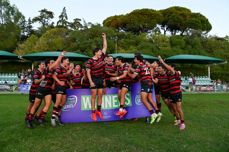 Youth rugby team celebrating their victory on the pitch during the Portugal Rugby Youth Festival Autumn Series 2025.