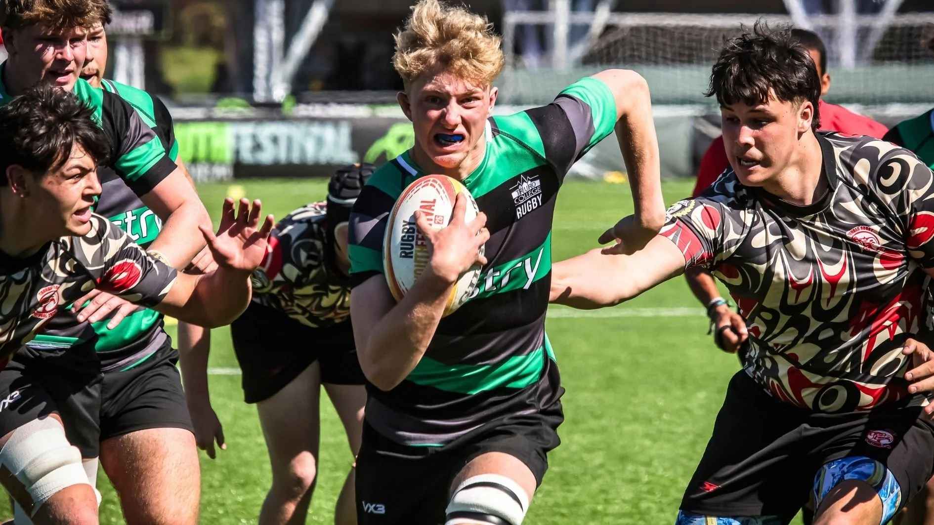 rugby-player-running-and-holding-thr-ball.jpg