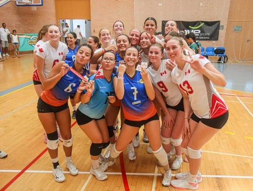 Youth volleyball teams posing together for a group photo during the Portugal Volleyball Festival 2025.